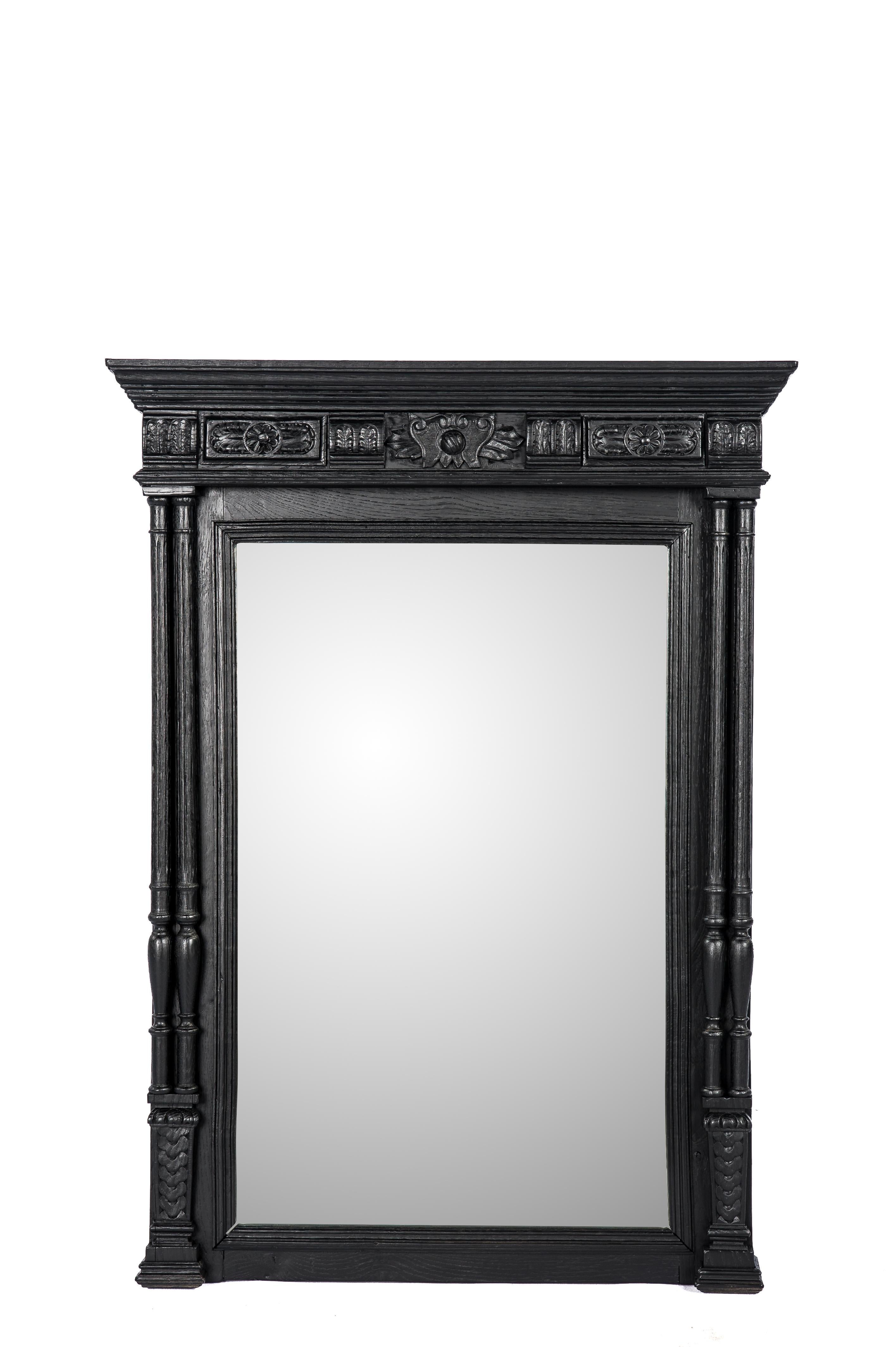 This bold mirror was made in France in the late 19th century. It is elaborately decorated with classical Henri II elements such as acanthus, pinnacles, and double columns. The mirror frame was completely made in the finest quality oak with highly