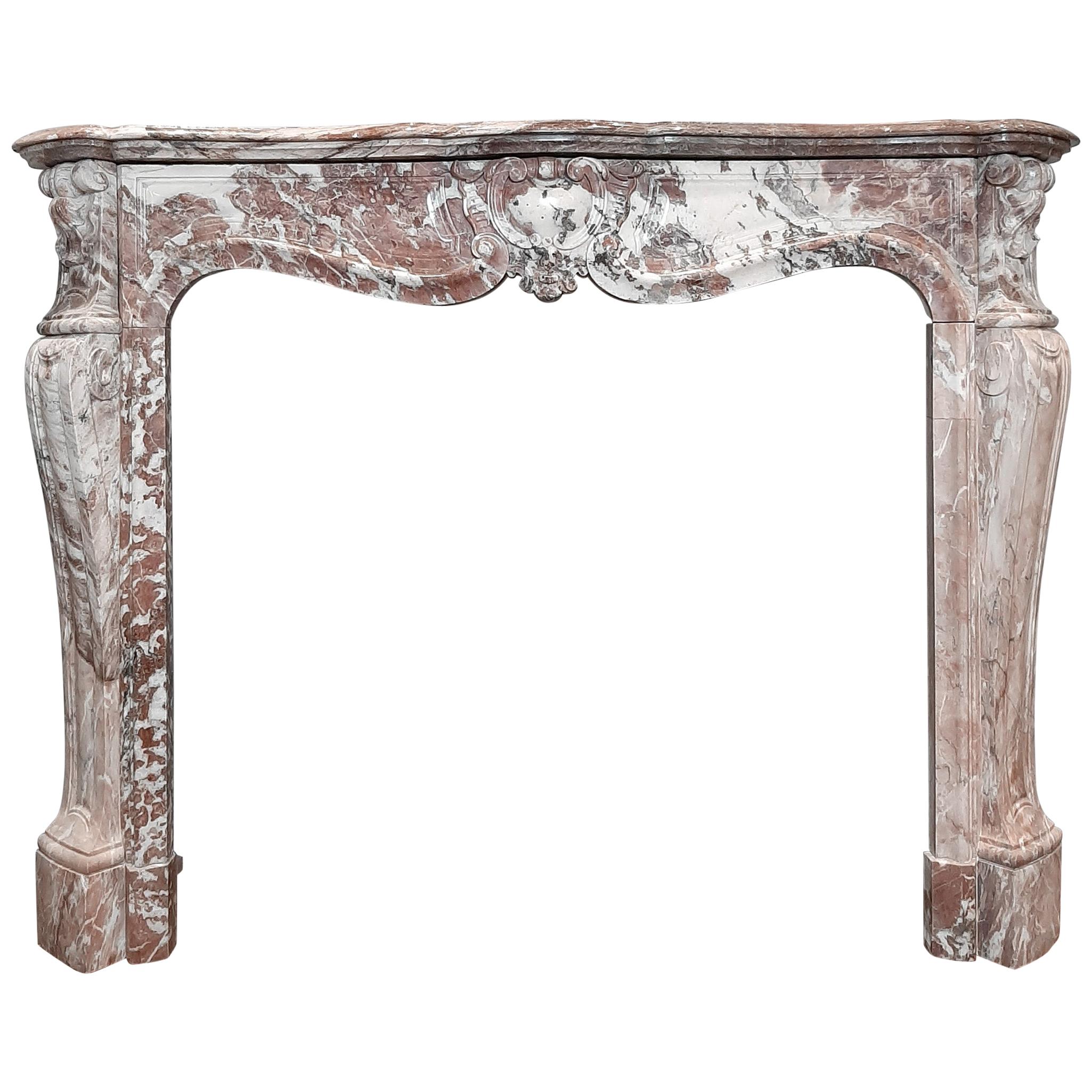 Antique French trois coquilles fireplace in violet, pink and white color tones. This mantel (fireplace) piece gets it's lovely coloring from the Violet de Villette marble.

Dimensions: H 111 x W 142 x D 40 cm
Inside dimensions: H 90 x W 102 cm

This