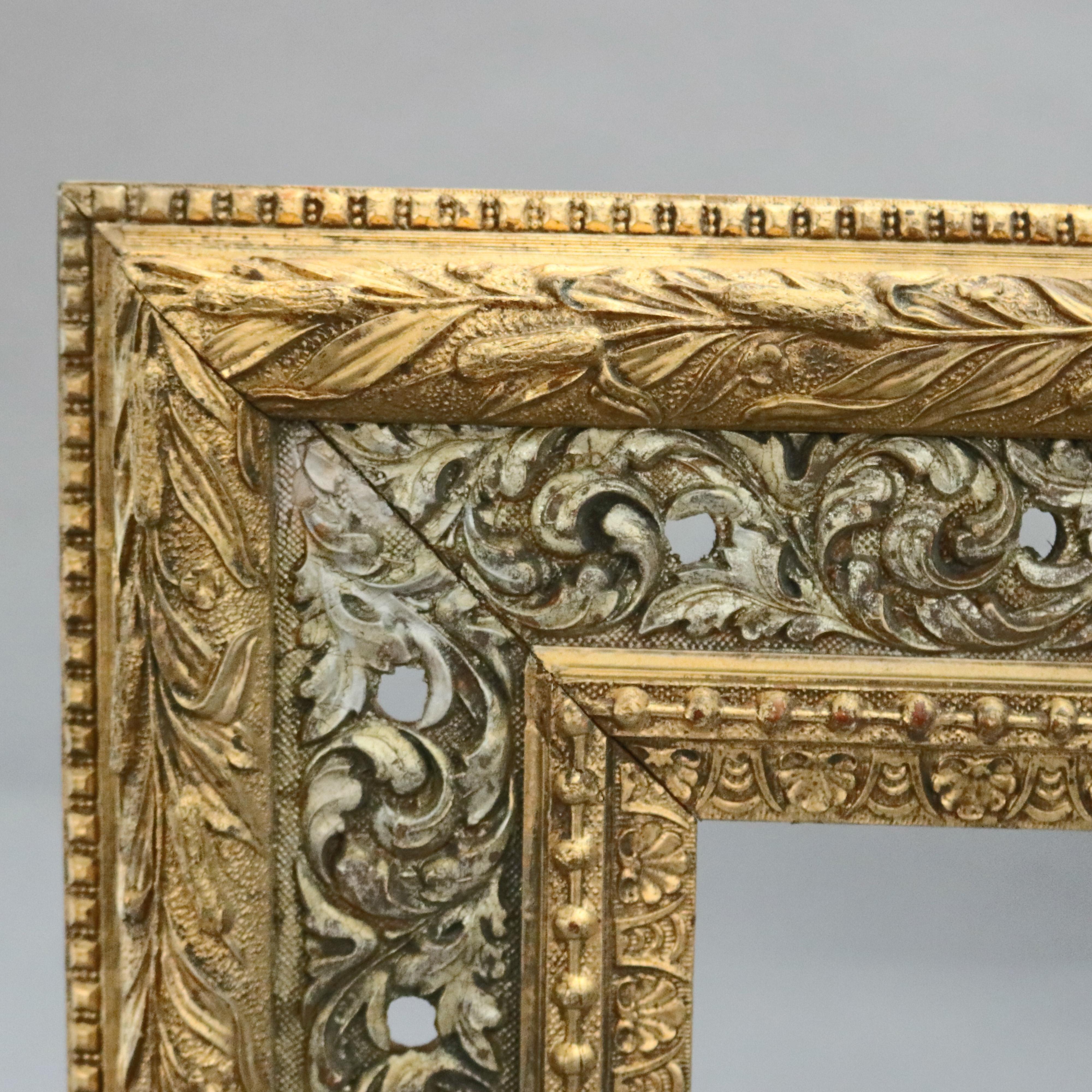 An antique French art frame offers first finish gold and silver giltwood having scroll and foliate pattern in relief, circa 1890

Measures: Overall 33.25