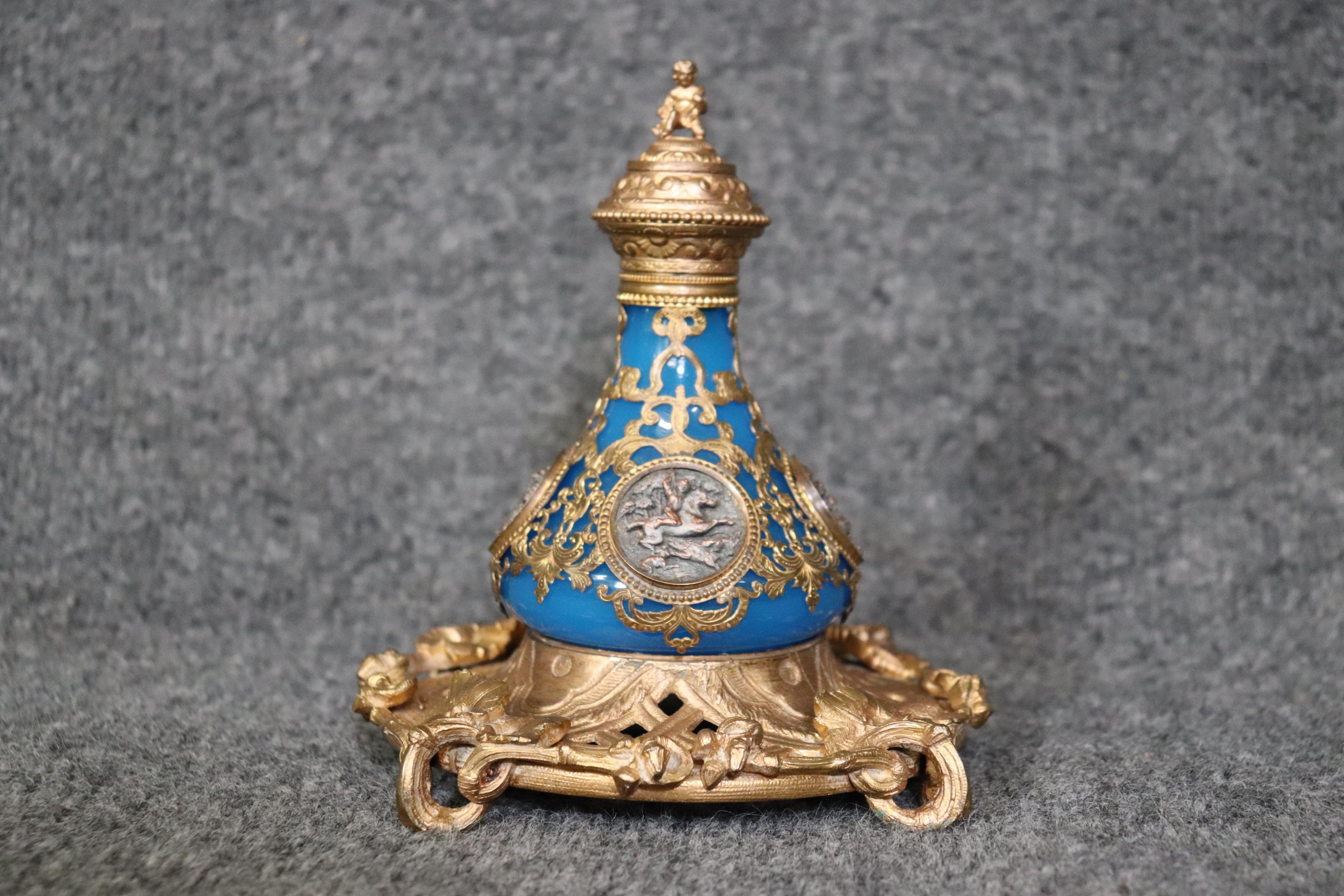 Dimensions- H: 6 1/2in W: 6in D: 6in 

This French Turn of the Century blue opaline and bronze ormolu 2 piece perfume bottle is made of the highest quality! If you look closely at the piece you can see the extremely detailed bronze ormolu mounts as
