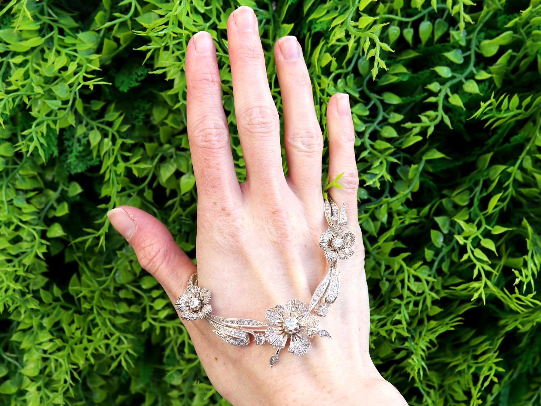 A stunning, fine and impressive antique French 8.50 carat diamond, 9 karat gold and silver necklace; part of our diverse diamond jewelry collection.

This stunning, fine and impressive antique French diamond floral necklace has been crafted in 9k