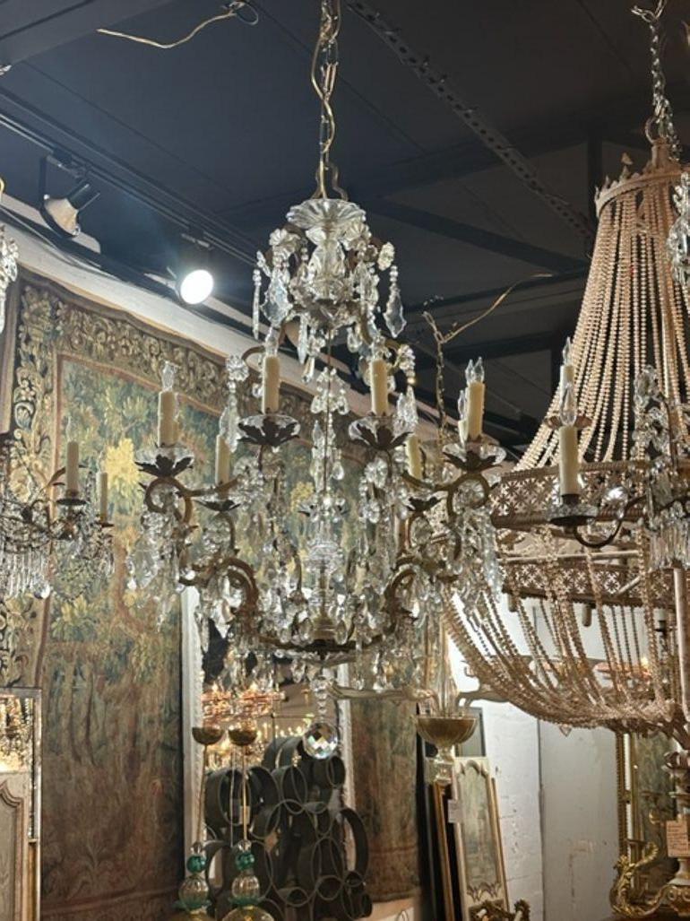 Gorgeous antique French chandelier after Maison Bagues. Covered in crystals on a beautiful base. A very fine quality chandelier that creates a huge impact. So elegant!!