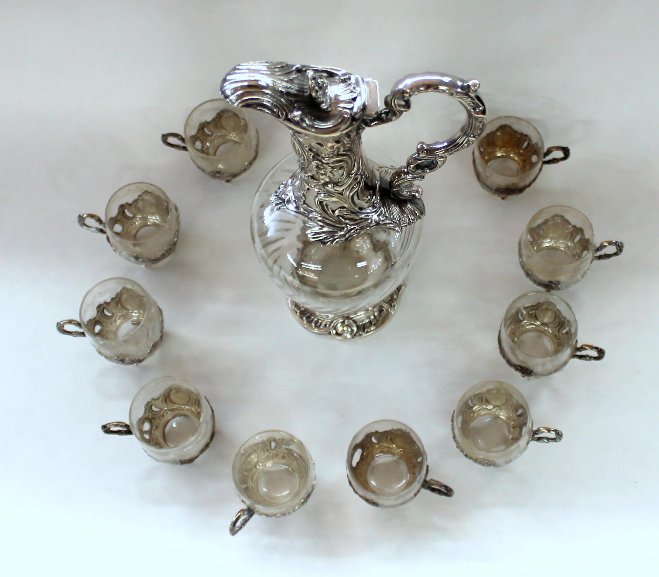 Rare and fine antique French .950 fine silver and hand-cut crystal 11 pc. Liqueur or cordial set (includes 10 hand cut crystal liqueur glasses in their original .950 fine hallmarked silver sleeves and one exceptional cordial decanter).

Any