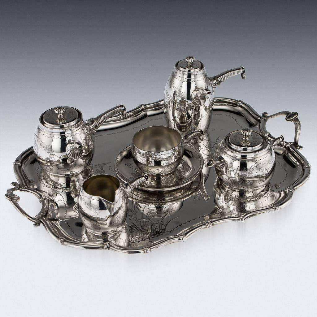 Antique 19th century French Aesthetic Movement solid silver bachelor tea and coffee set, comprising of coffee pot, teapot, sugar bowl, cream jug, tray and cup with saucer. The set is extremely unusual in design and finely crafted, engraved with