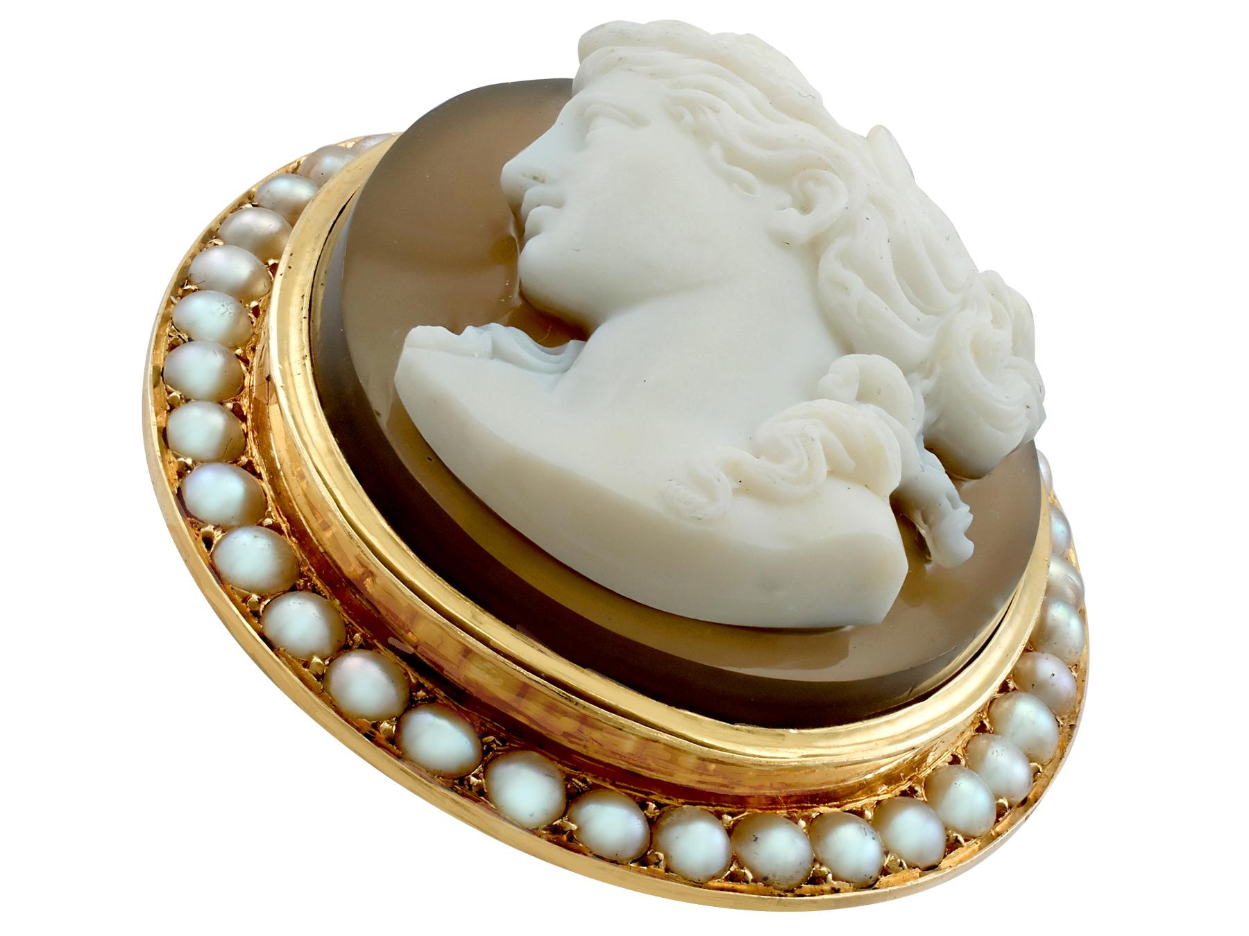 An impressive antique French agate and seed pearl, 18 karat yellow gold cameo brooch; part of our diverse antique jewelry and estate jewelry collections.

This fine and impressive antique cameo brooch with diamonds has been crafted in 18k yellow