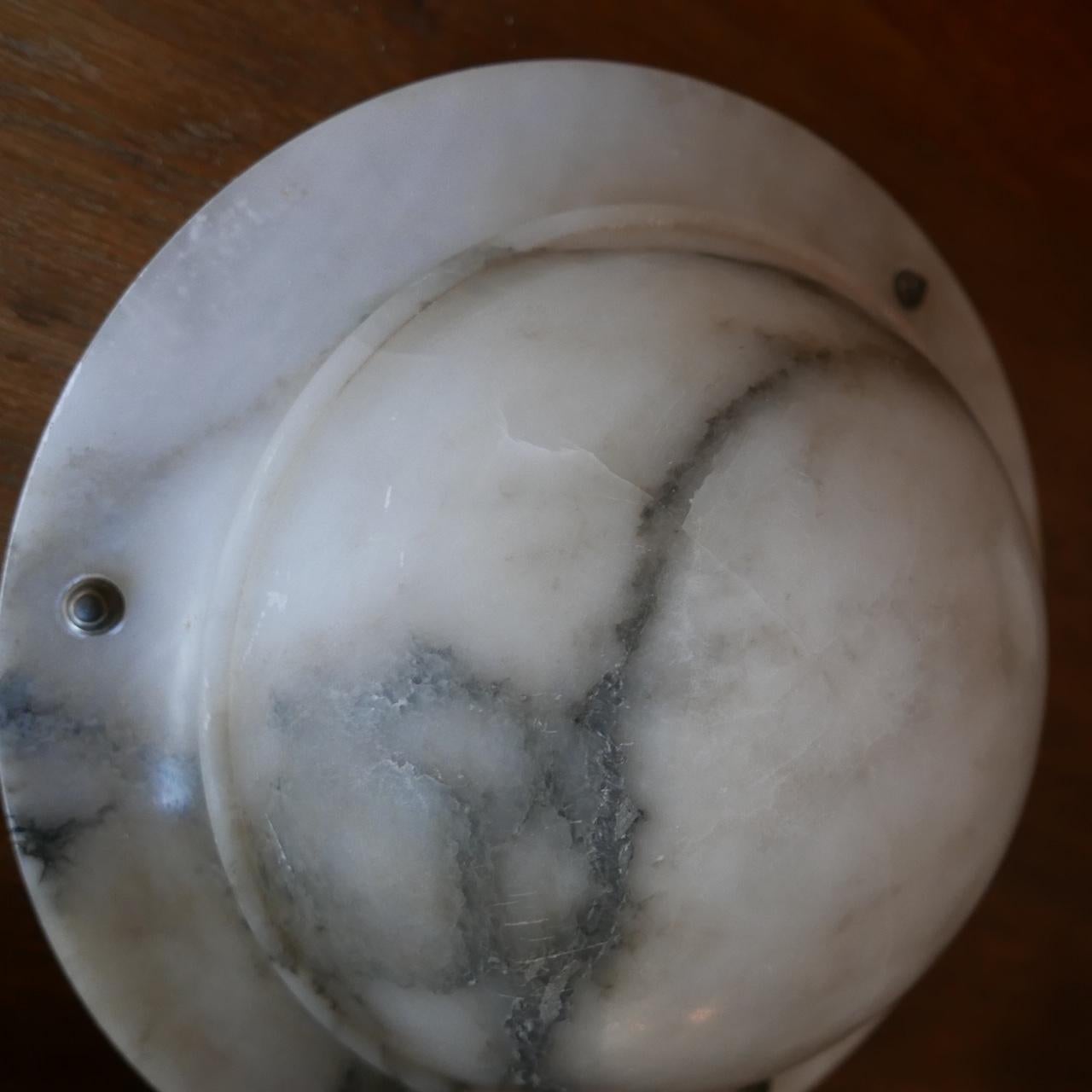 A stylish alabaster veined stone plafonnier. 

France, c1920s. 

Some natural veins and faults. 

Good condition, re-wired and PAT tested. 

Ceiling rose retained which goes straight into the ceiling, with chains coming down to hold the