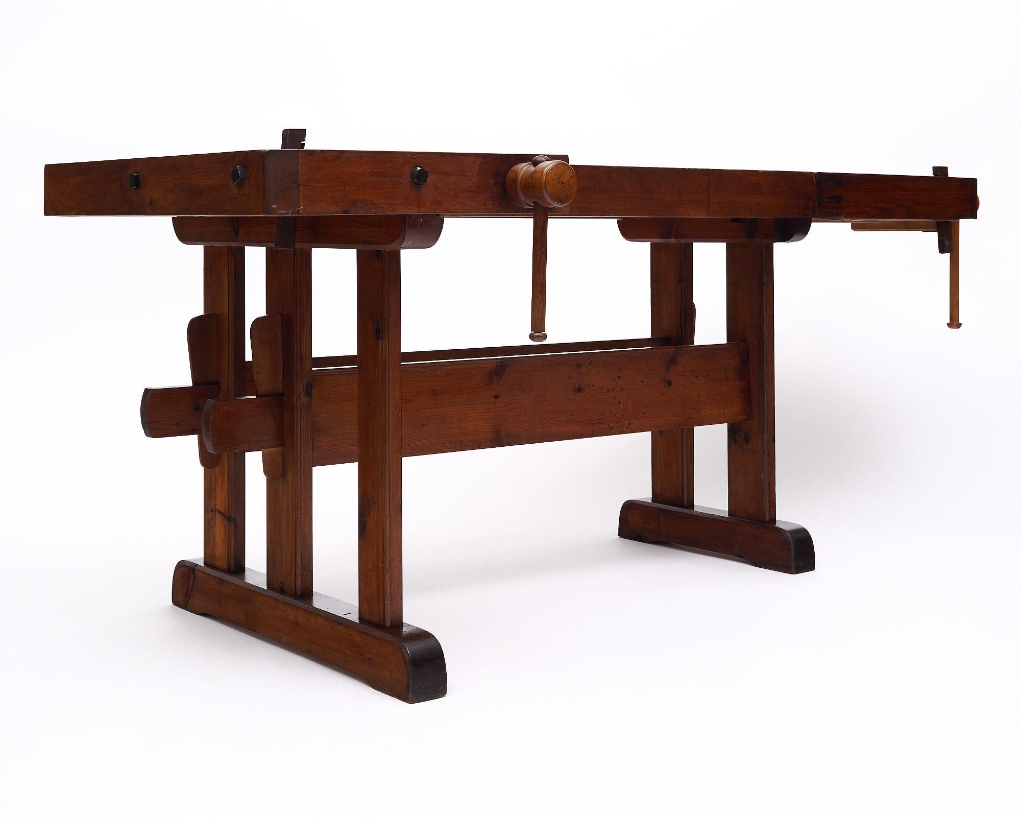 An important antique craftsman's workbench from the Italian Alps used in the making of wooden skis. Solid chestnut and fir, complete with its hand-crafted wooden and forged iron vices. A beautiful and amazing feat of woodworking.
