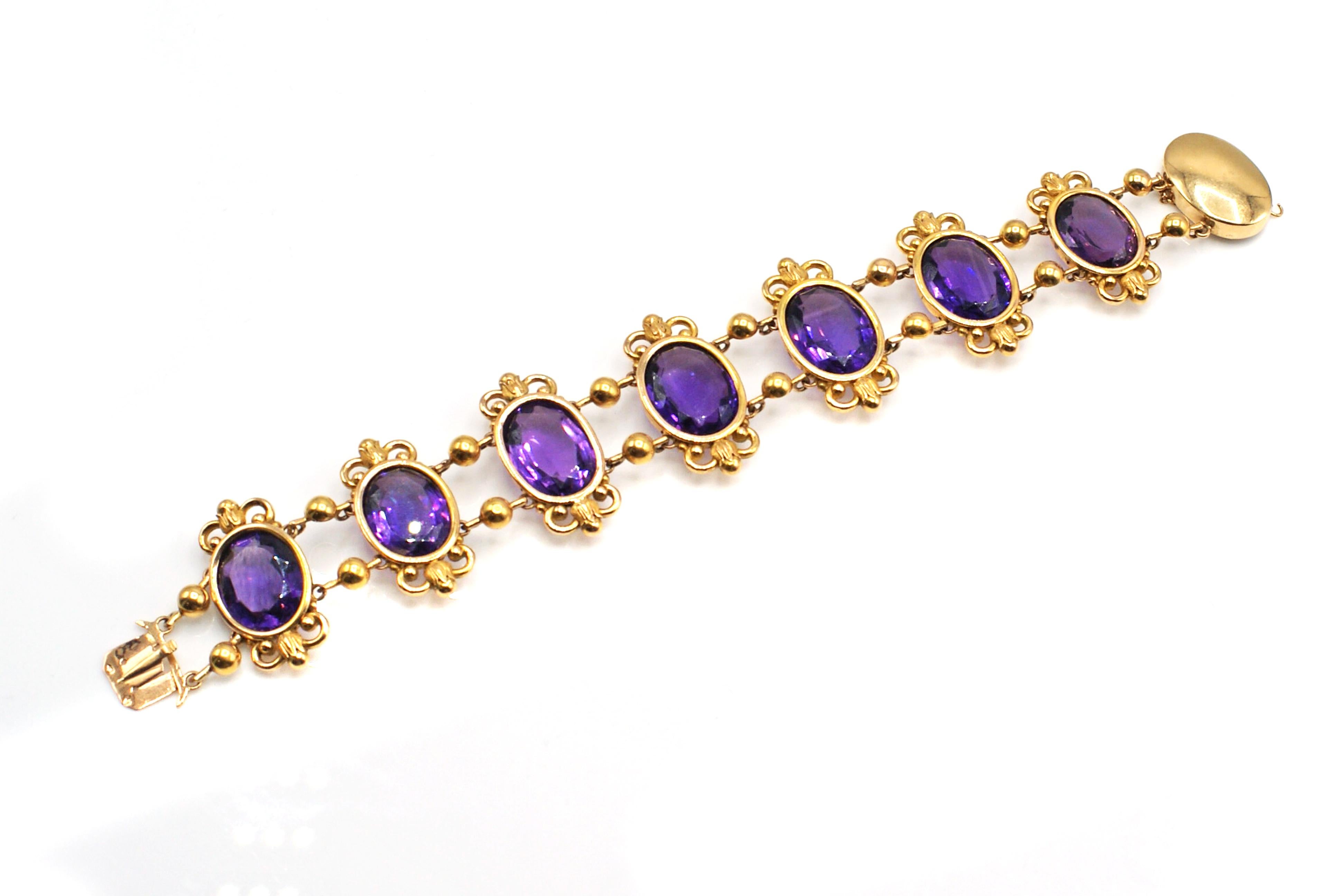 Gorgeous antique French Amethyst 18 karat yellow gold flexible link bracelet from ca. 1880. Seven beautiful, lively and sparkling deep violet Amethysts are the center pieces of this lovely bracelet. Perfectly matched in color and cut these gemstones