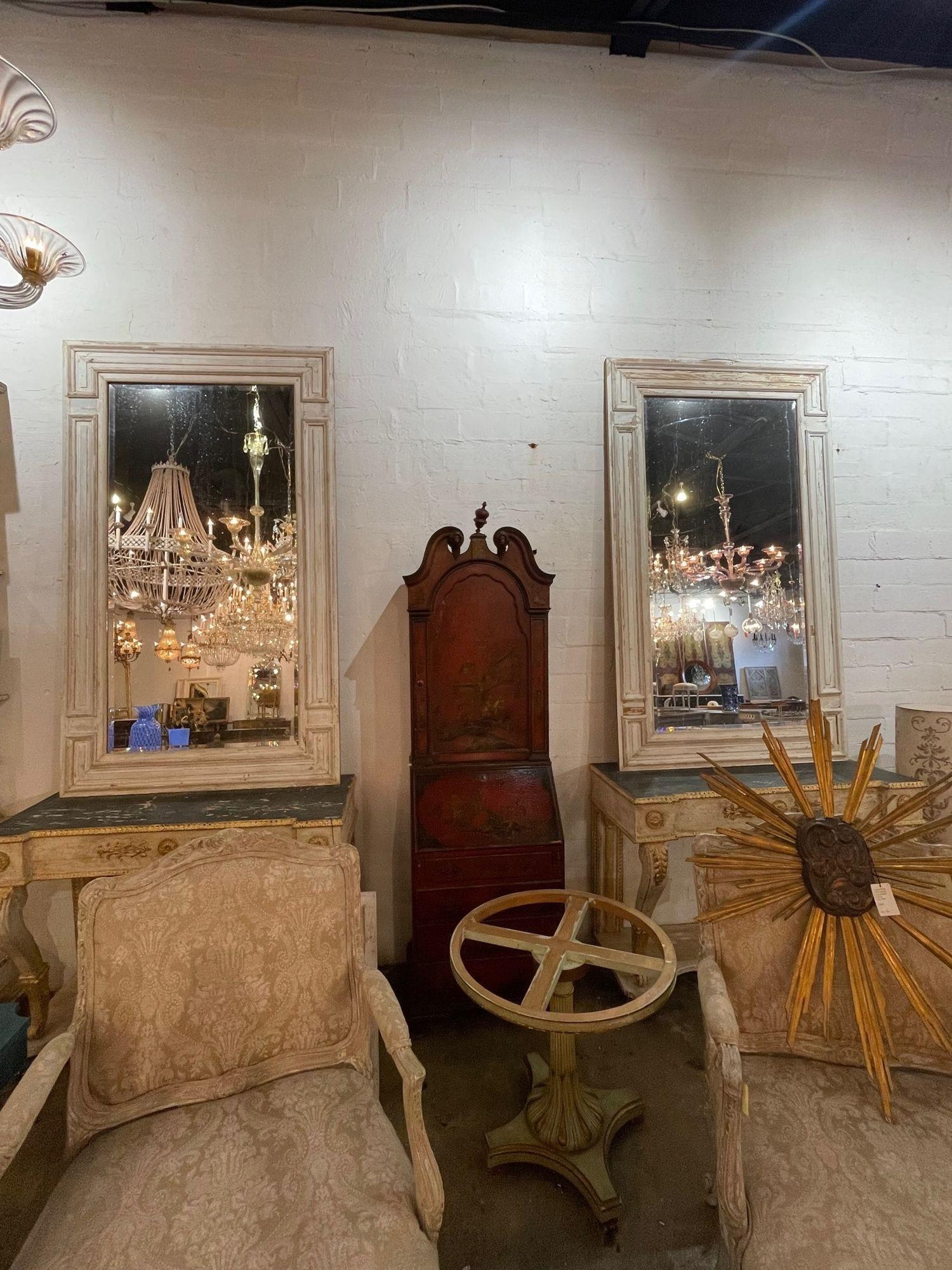 Gorgeous antique French gesso washed mirrors made of architectural panels. These have a great patina and would work well with a variety of decors.  Lovely!
Note: Price listed is for 1 mirror