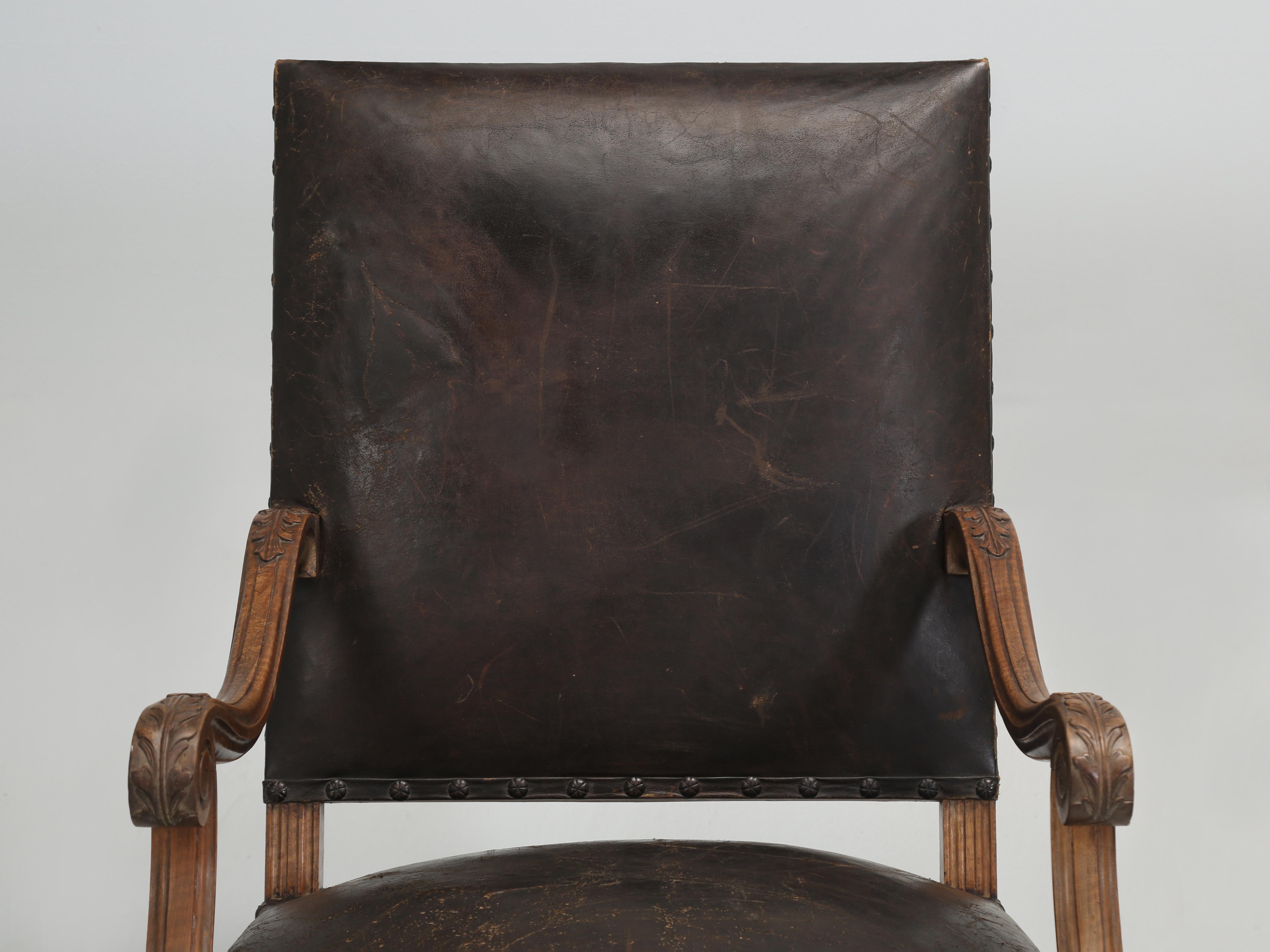 Antique French Armchairs hand carved from solid Figured Walnut in the late 1800s. Some dealers might refer to these as a 