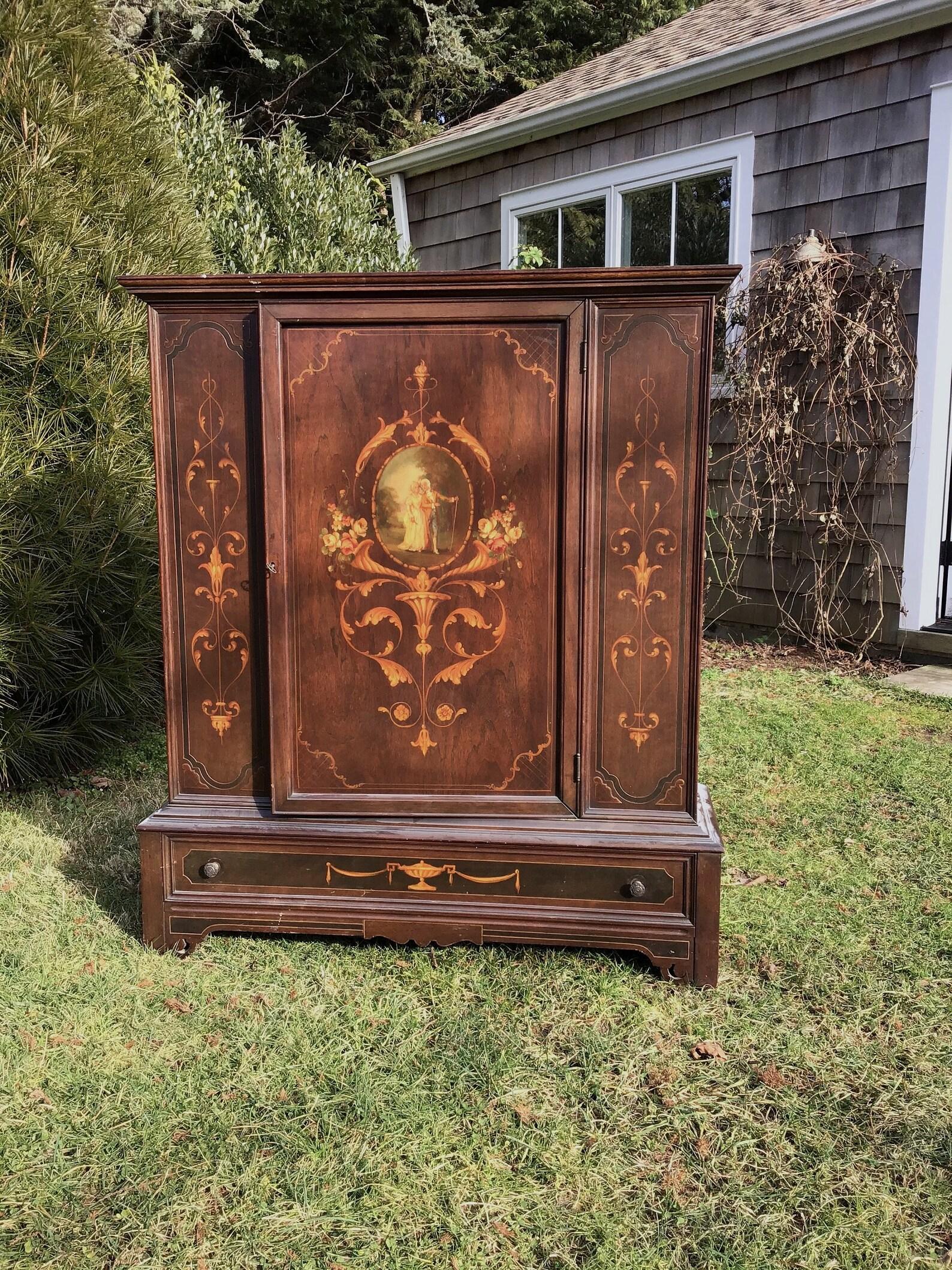 Antique French armoire is hand painted with French scenes on the Victorian wardrobe.
   