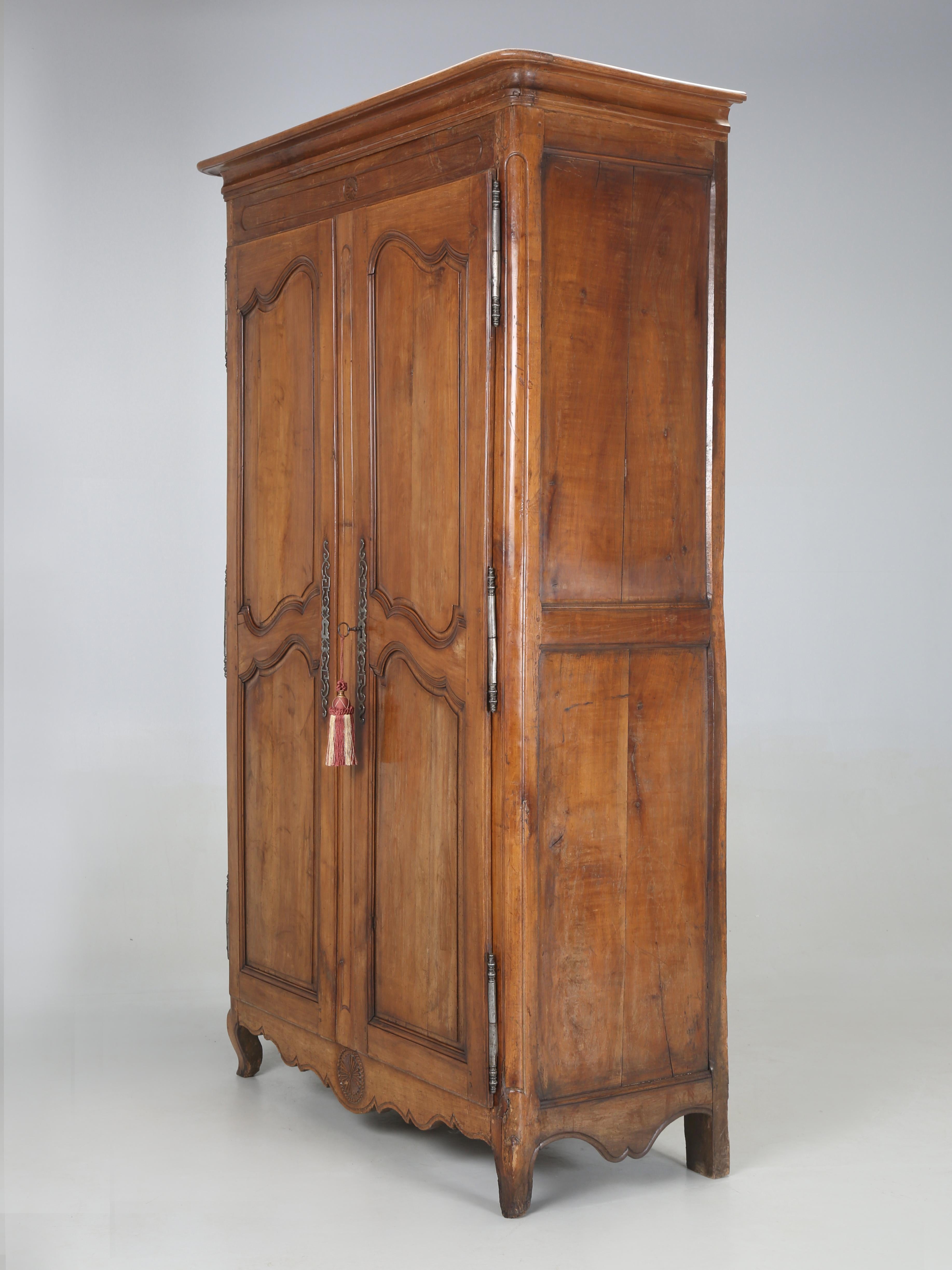 Antique French Louis XV Armoire in Beautiful Original Condition. Our Old Plank Restoration department concluded that since this Antique Armoire arrived in such a nice unrestored state that the most prudent way forward would be a sympathetic