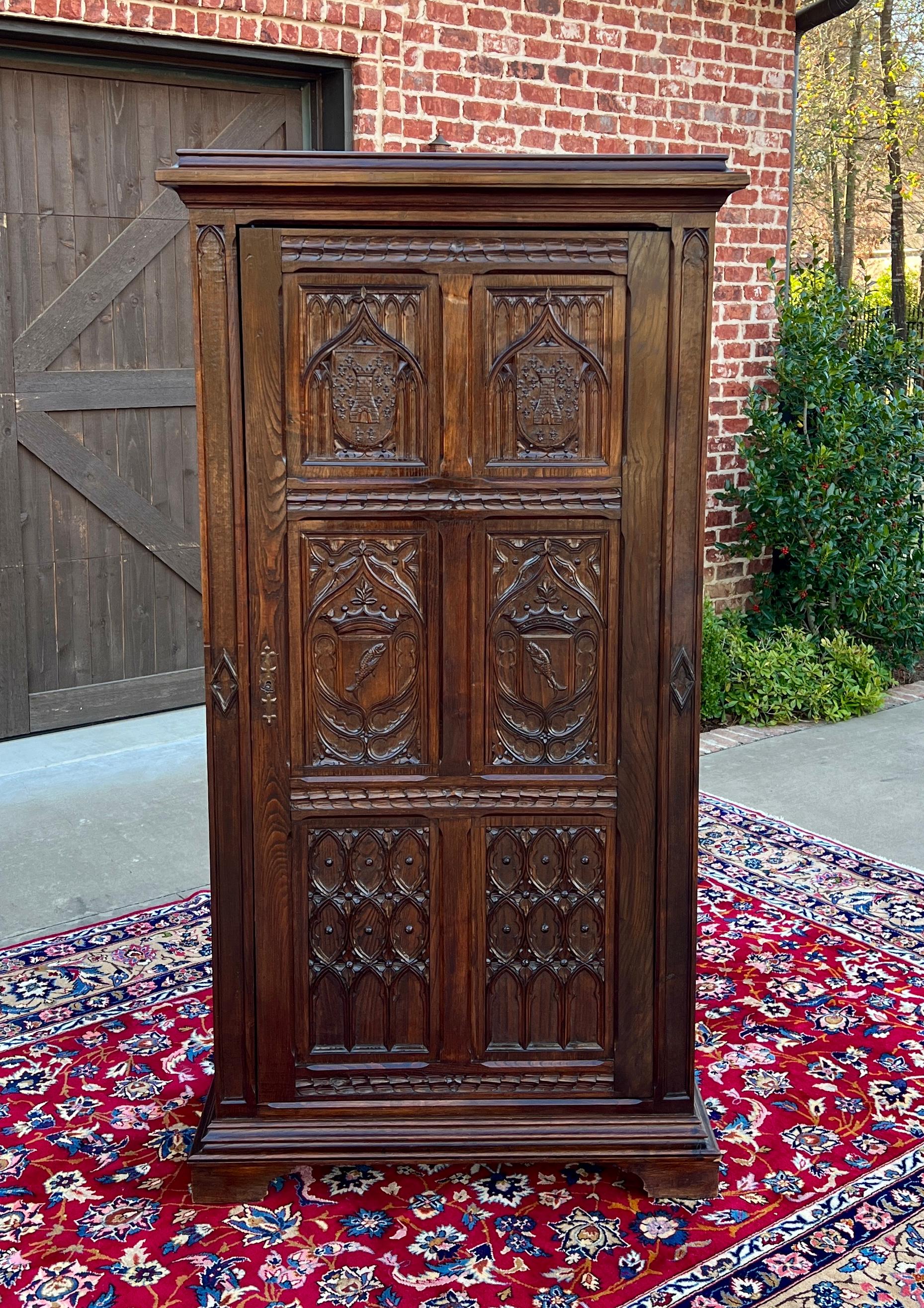 SUPERB Antique French GOTHIC REVIVAL Oak  Armoire, Linen Cabinet, Wardrobe, or Chest~~HIGHLY CARVED~~c. 
1890s 


        BEAUTIFUL STATEMENT PIECE~~19th century French Gothic Revival oak armoire, wardrobe, or linen cabinet with exquisitely carved