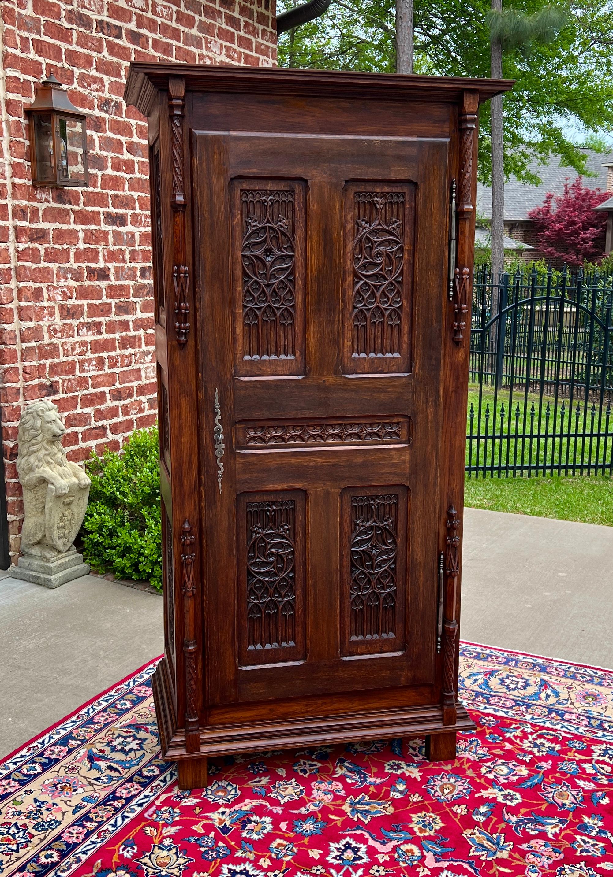 SUPERB Antique French GOTHIC REVIVAL Oak  Armoire or Wardrobe~~HIGHLY CARVED~~c. 
1880s 


        BEAUTIFUL STATEMENT PIECE~~19th century French Gothic Revival oak armoire or wardrobe exquisitely carved front and sides with  working key~~excellent