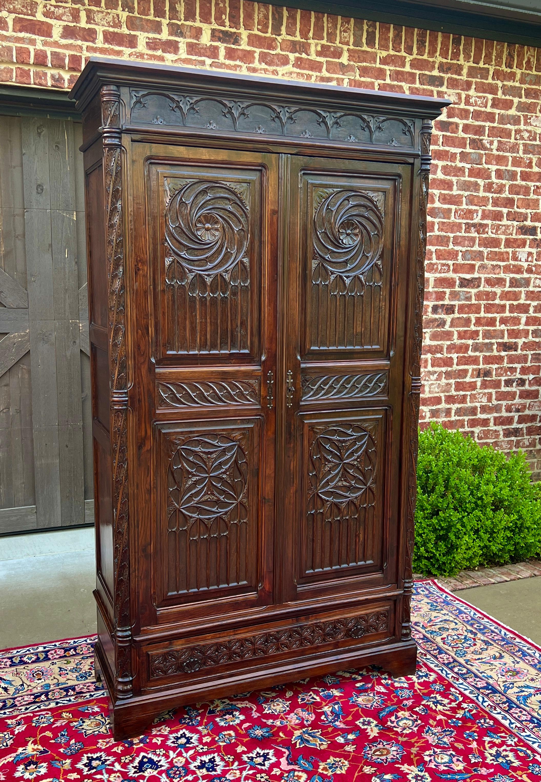 SUPERB Antique French GOTHIC REVIVAL Oak  Armoire, Wardrobe or Cabinet~~HIGHLY CARVED~~c. 
1880s 


        BEAUTIFUL STATEMENT PIECE~~19th century French Gothic Revival large oak armoire or wardrobe exquisitely carved Gothic arches and tracery