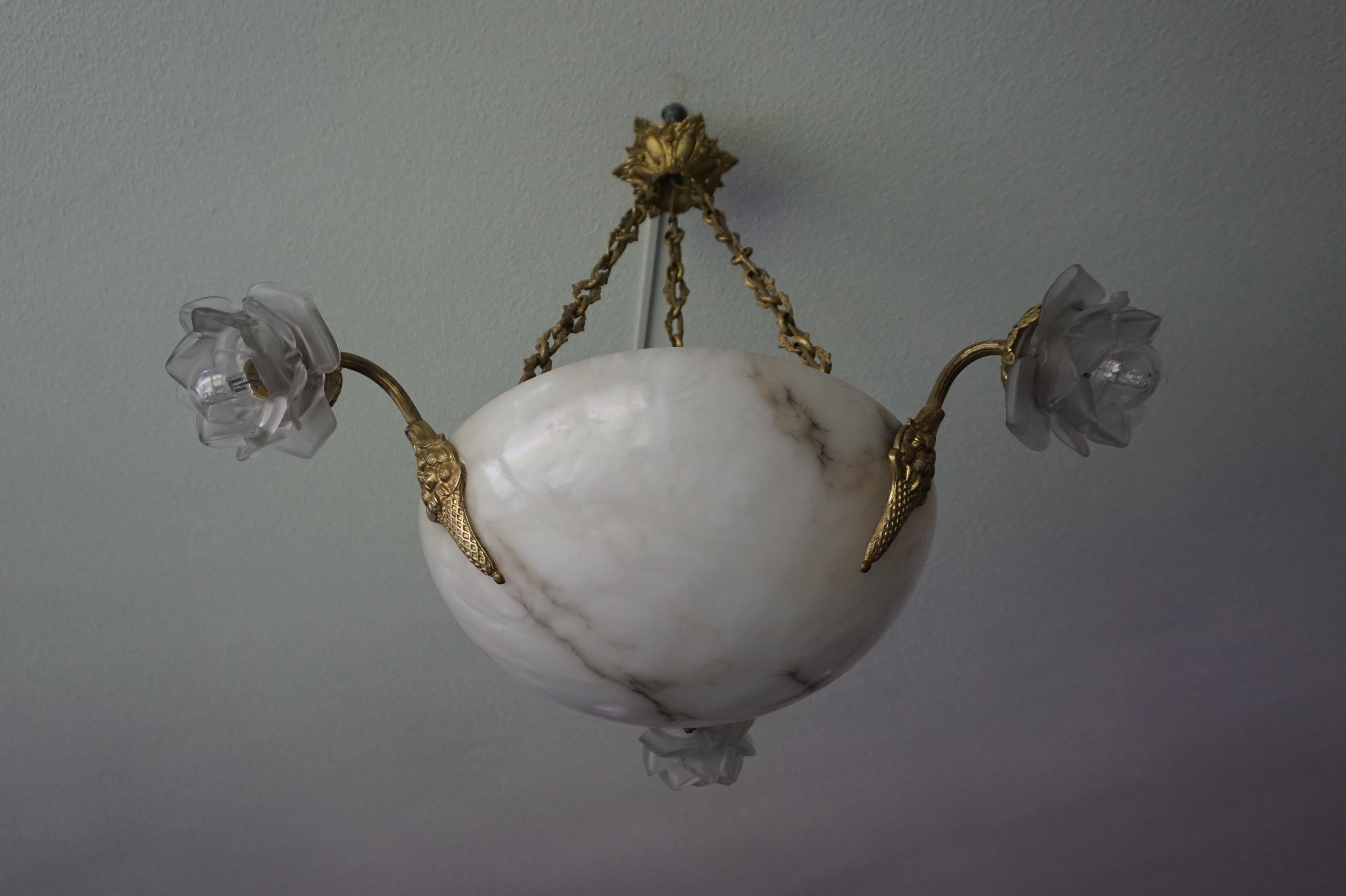 Vintage French, four light pendant.

This stunning and highly stylish chandelier originates from early twentieth century France and to have found it in this superb condition more than made our day. The alabaster bowl has no cracks or chips at all