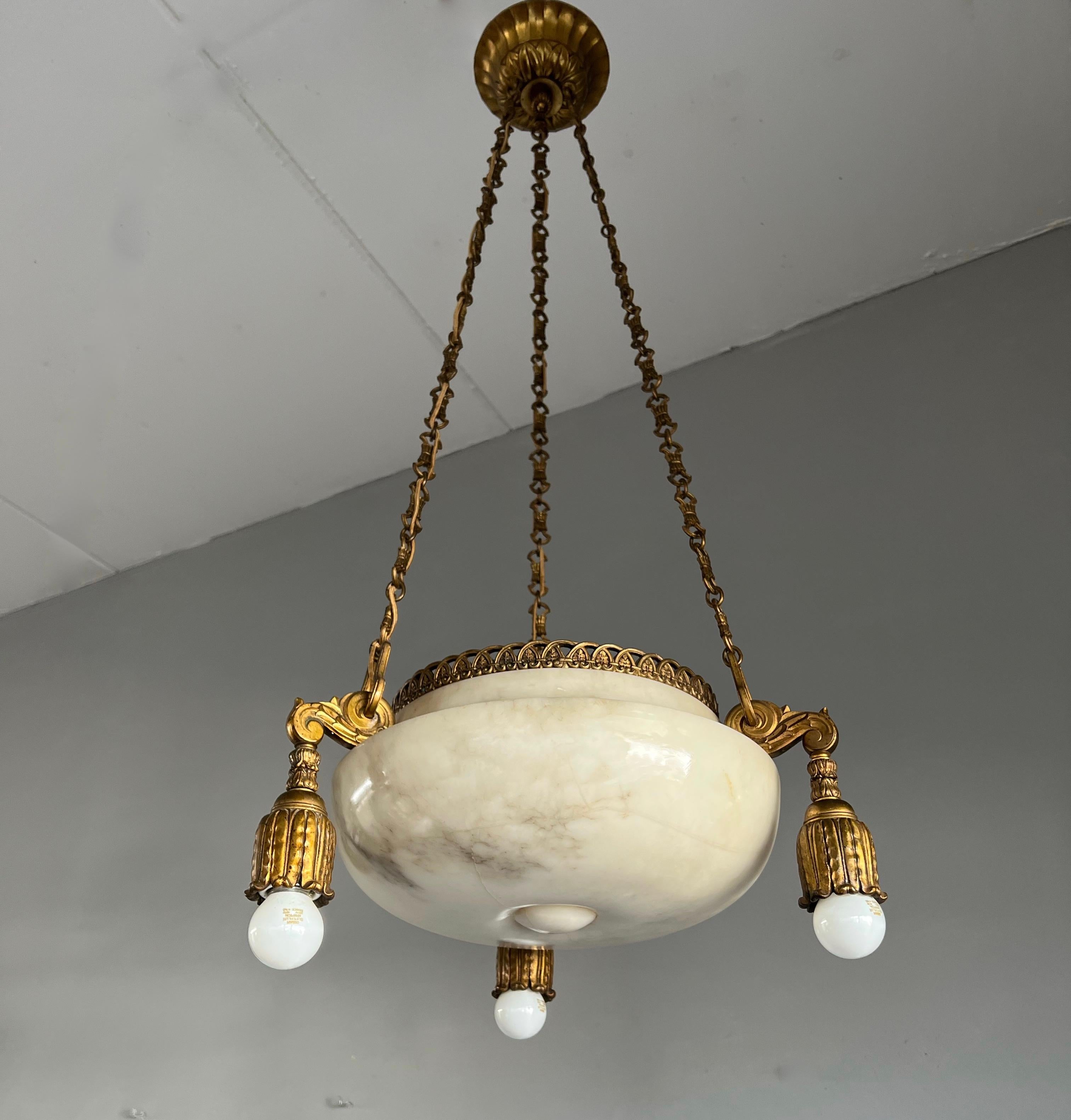 Antique French, four light pendant.

This stunning and highly stylish chandelier originates from early twentieth century France and to have found it in this good condition again felt like a blessing. The stylish design alabaster bowl is as strong