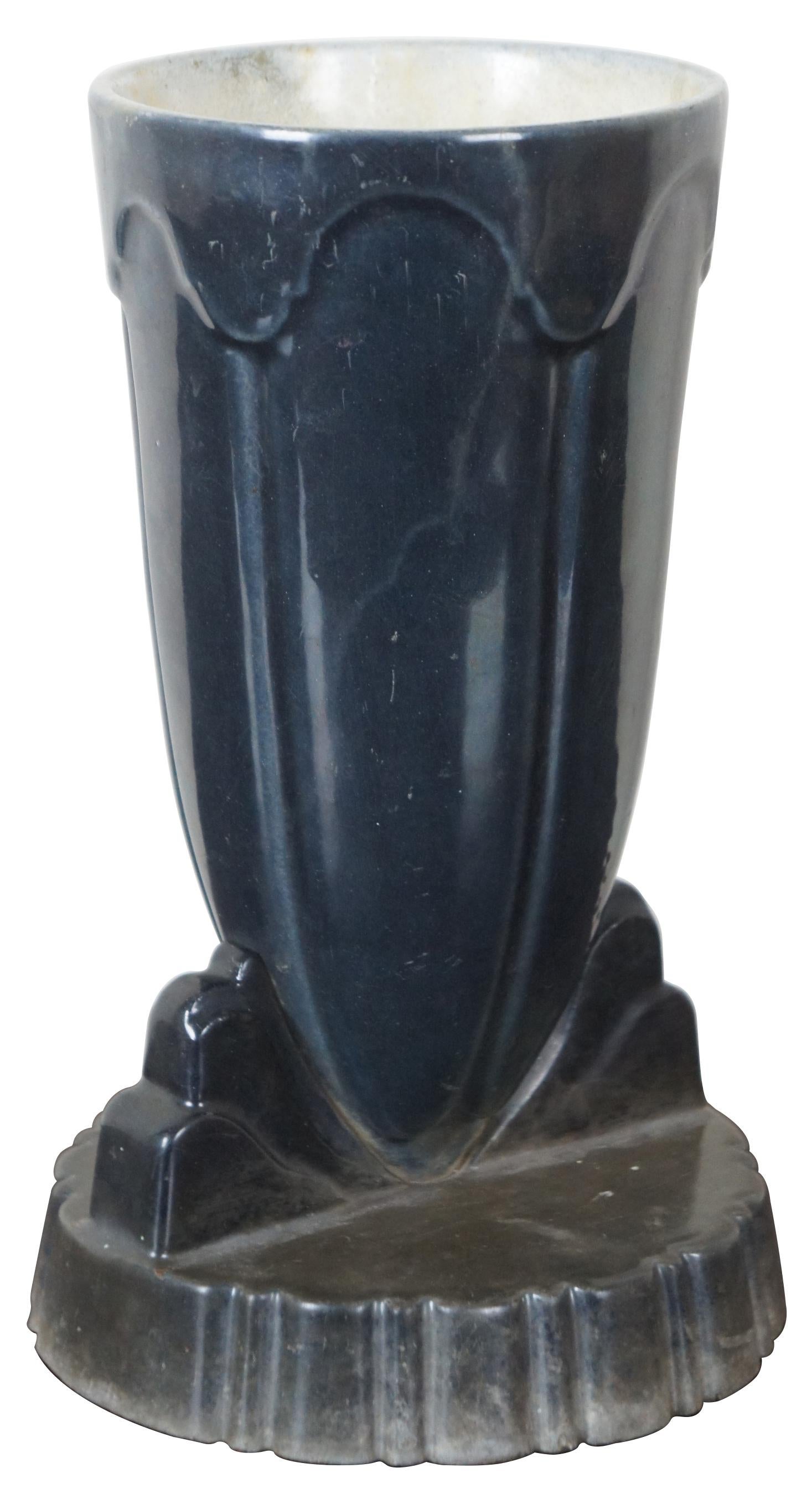 Vintage Art Deco enameled heavy black or charcoal gray cast iron trophy urn or planter with round pedestal base.
 