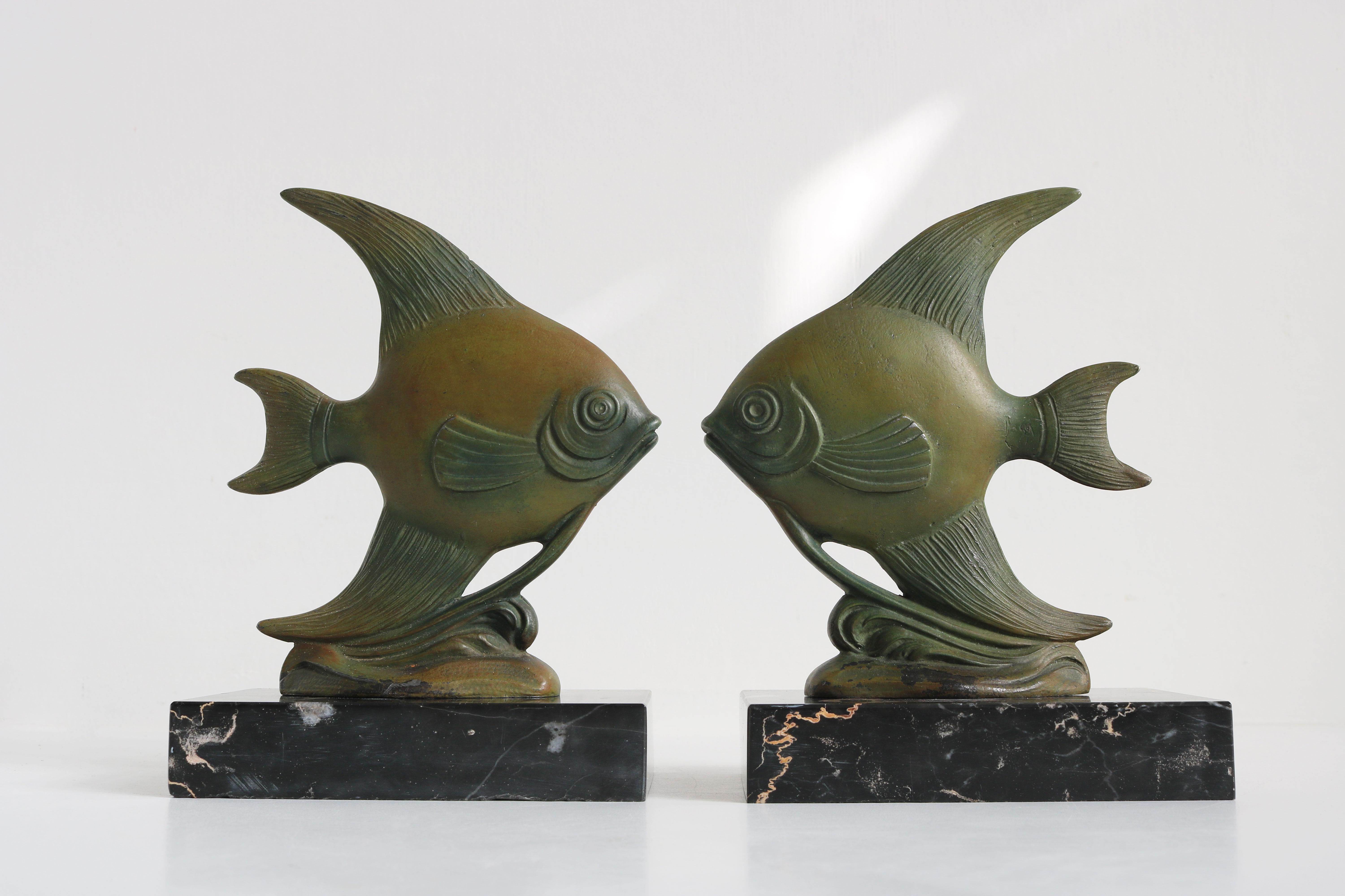 Stylish & Timeless! These French Art Deco Angelfish bookends from the 1930s. 
Marvelous Art Deco design with the right patina and feel to them. 
The Angel fish are styled perfectly in the Art Deco design style and are displayed on gorgeous black