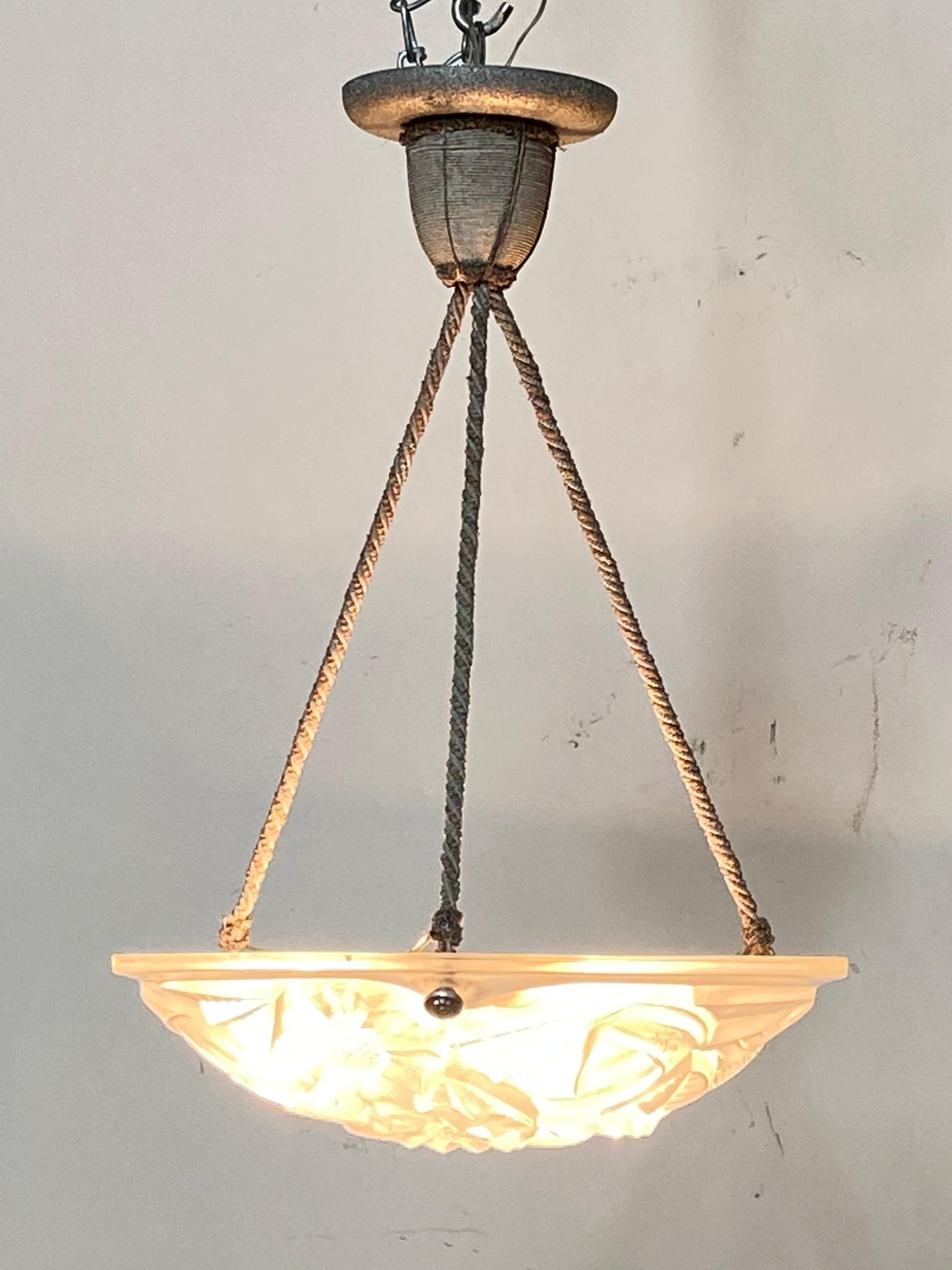 Antique French Art Deco (circa 1925) frosted glass ceiling fixture with original braided fabric hanger in good condition. Shows minor signs of wear., but works perfectly. The fixture is shown with high wattage bulbs. We would recommend lower