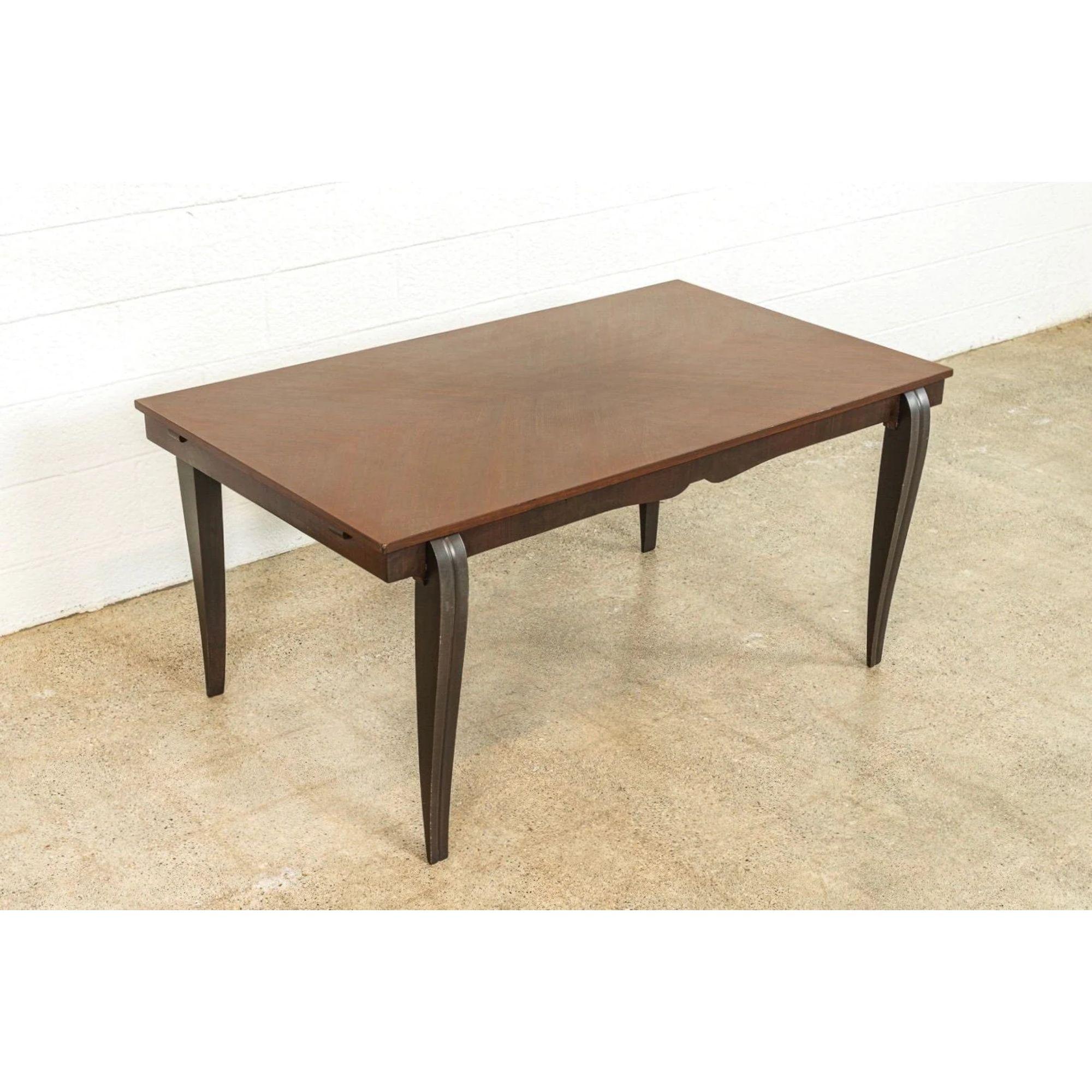 This French Art Deco carved mahogany dining table or large writing desk from the early 20th century features a beautiful geometric marquetry wood tabletop with arrow pattern supported by elegant gently curved and tapering cabriole legs. Perfect for