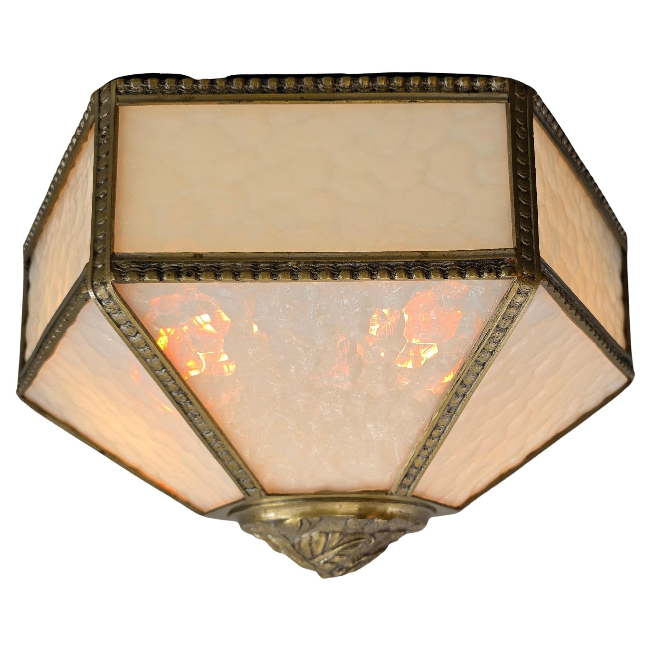 Antique French Art Deco Flush Mount Ceiling Light in Glass and Bronze, circa 1920

Rare hexagonal flush mount ceiling light from the early Art Deco period, made in France around 1920. This refined fixture features textured opaline glass panels in a
