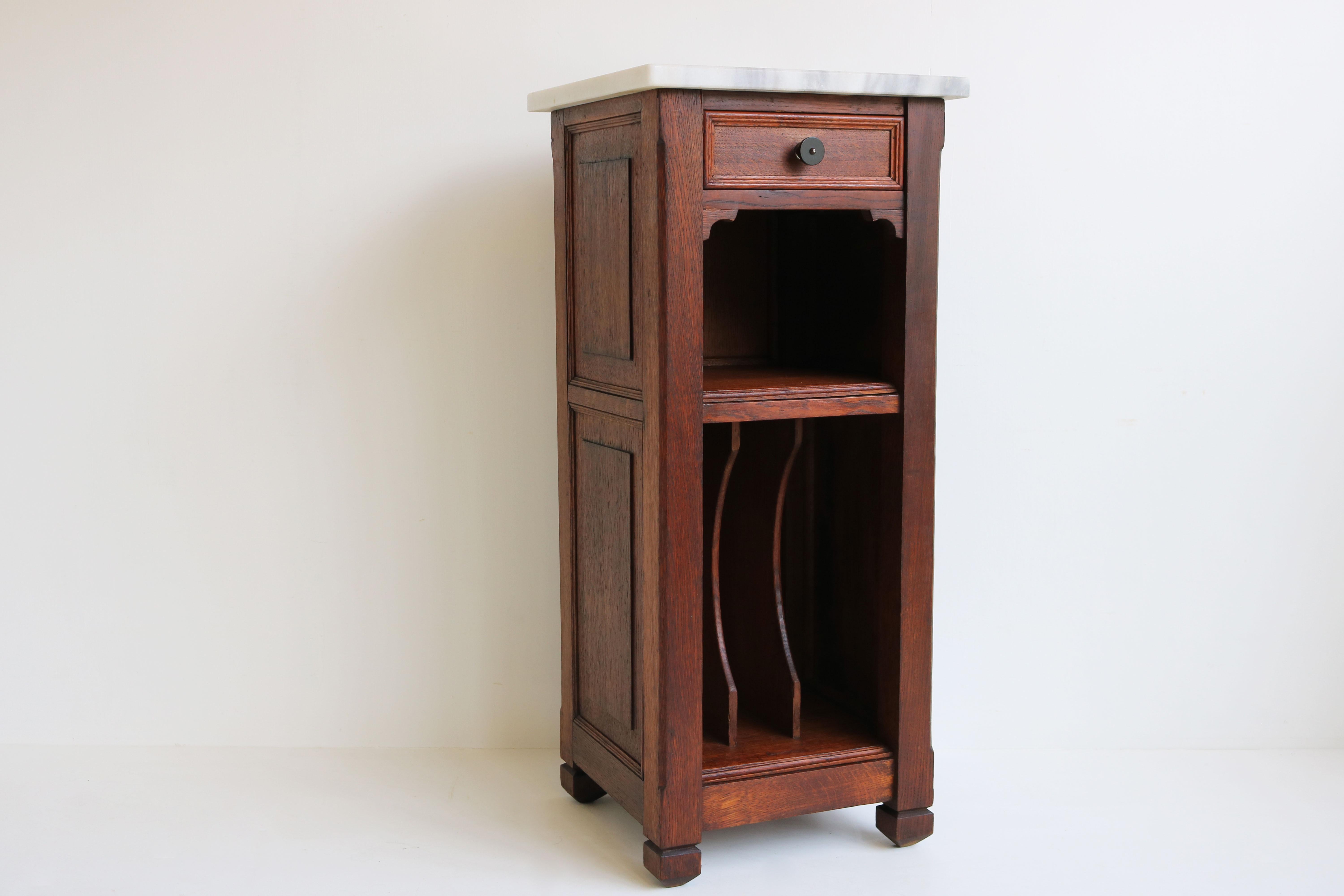Gorgeous French Art Deco nightstand / Record cabinet from the 1920s in solid oak with rare stripe marble from Greece. 
The cabinet has 1 drawer, 1 open compartment and 1 record / book compartment on the bottom side. 
The cabinet is finished on all