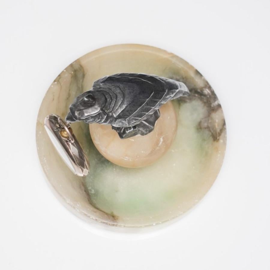 Here is a lovely Antique French Art Deco Parrot Themed Pocketwatch Holder. This piece features a spelter parrot perched upon an alabaster base. Includes complimentary metal pocketwatch (not working). French circa 1930s.