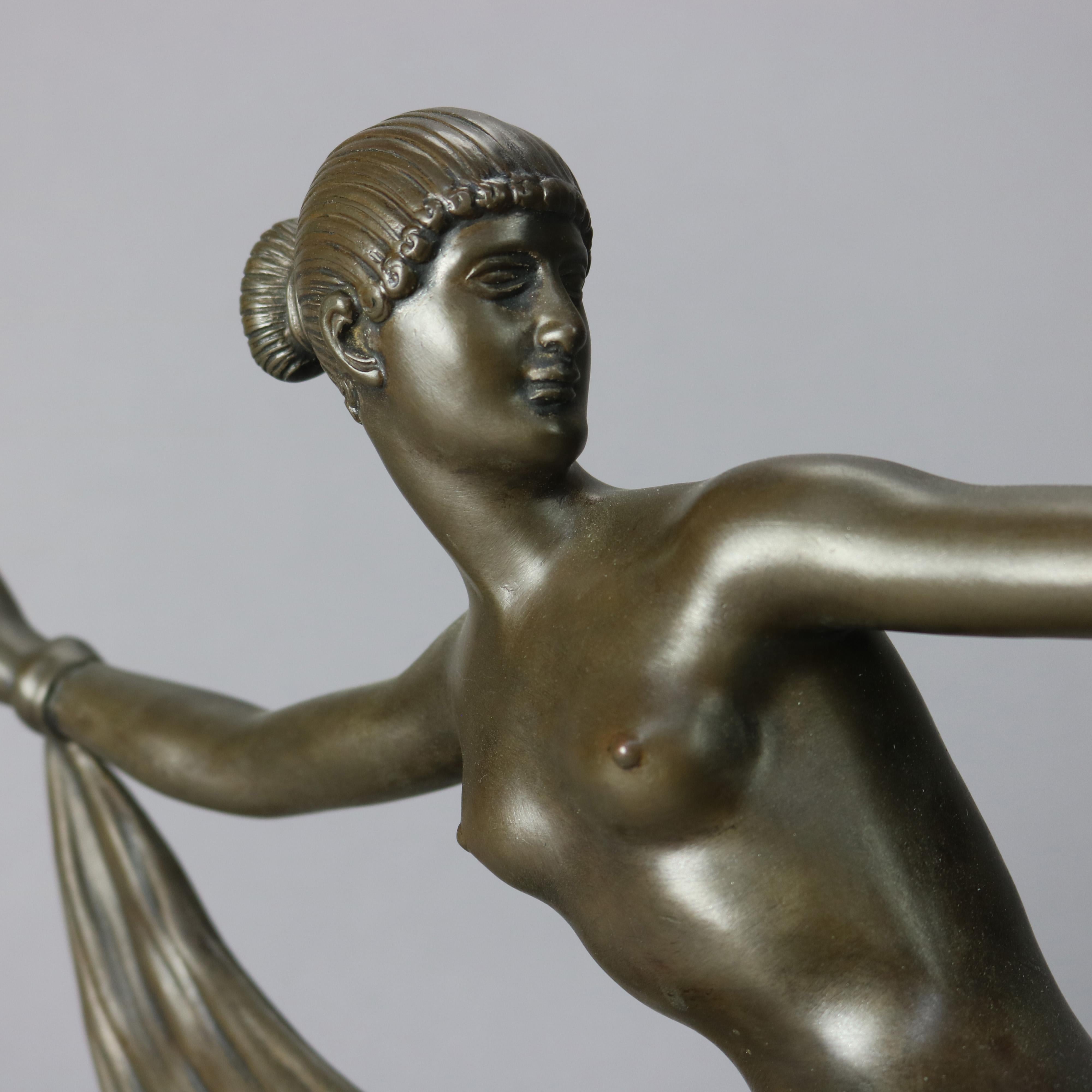 A French Art Deco sculpture depicts a dancing woman with scarf; seated on marble plinth; 20th century

Measures - 14.25