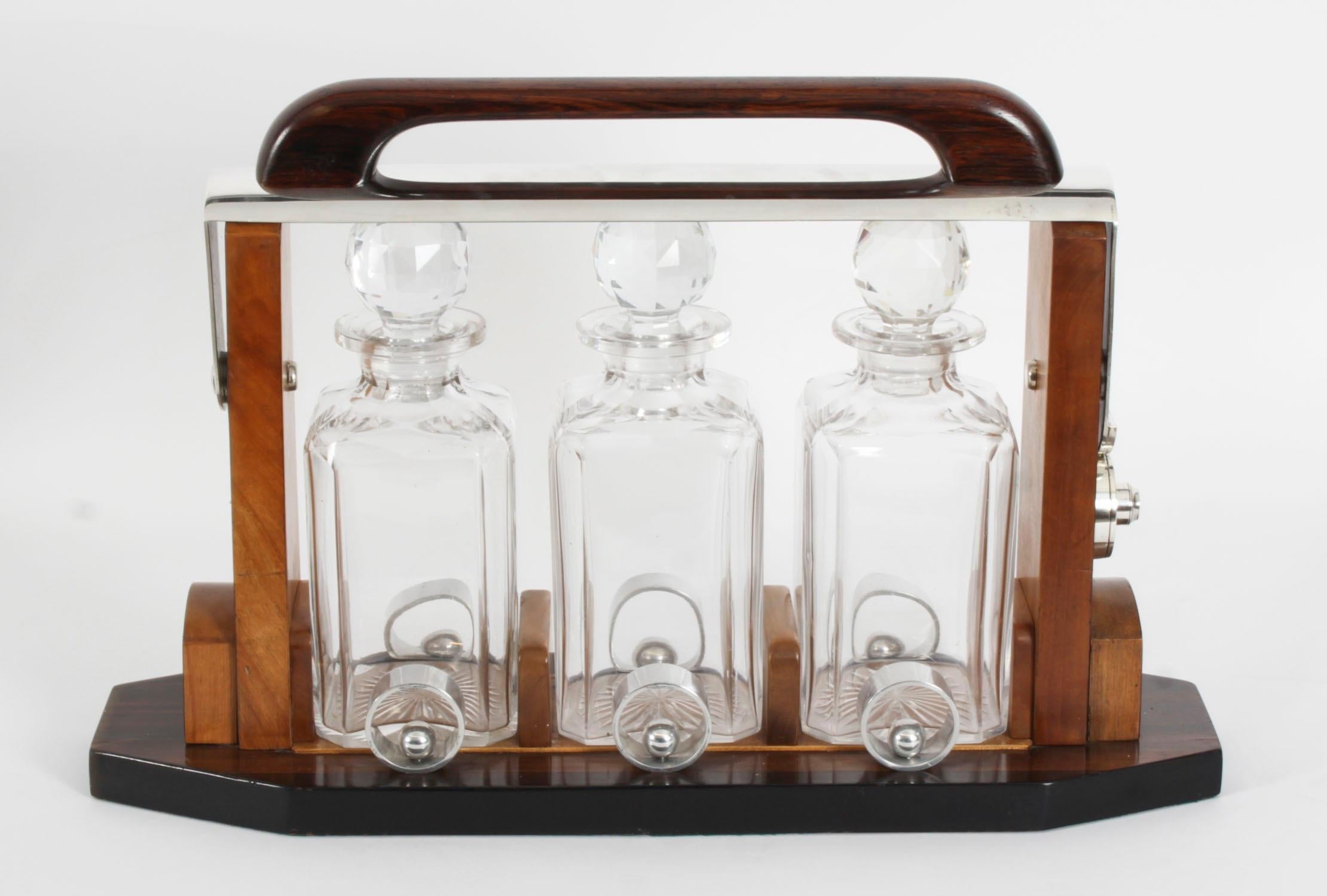 A superb and rare antique French Art Deco decanter set, designed by Louis Prodhon, Paris,  Circa 1930 in date.

It was the award-winning design at the 1937 Exposition Des Arts Decoratifs Paris.

This beautiful antique  three decanter tantalus was