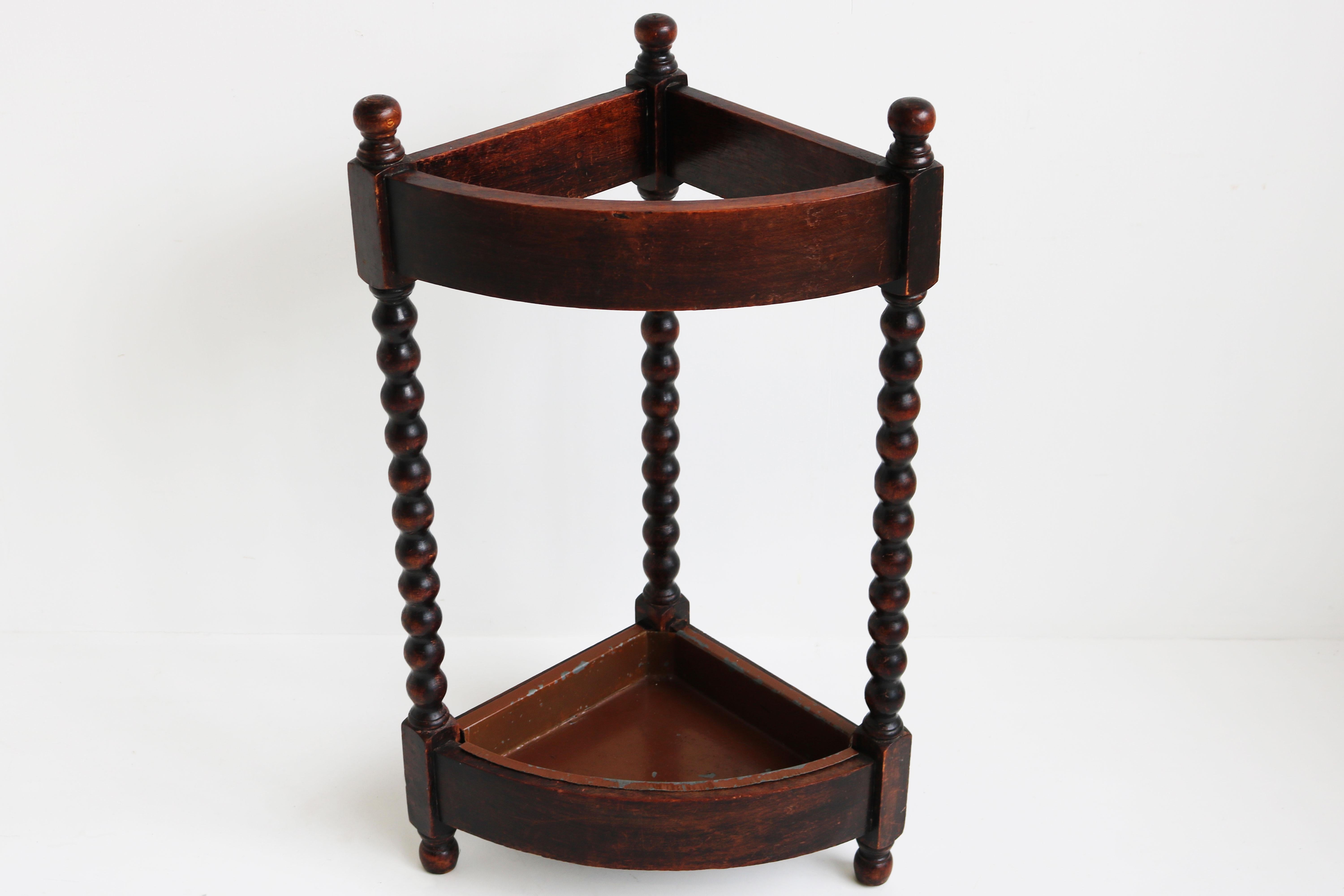 Gorgeous solid oak French Art Deco period umbrella stand / stick holder dated 1930
Decorated with carved balls (very similar to barley twist) can be placed into a corner but looks just as great as a hallway centerpiece.
Very practical and