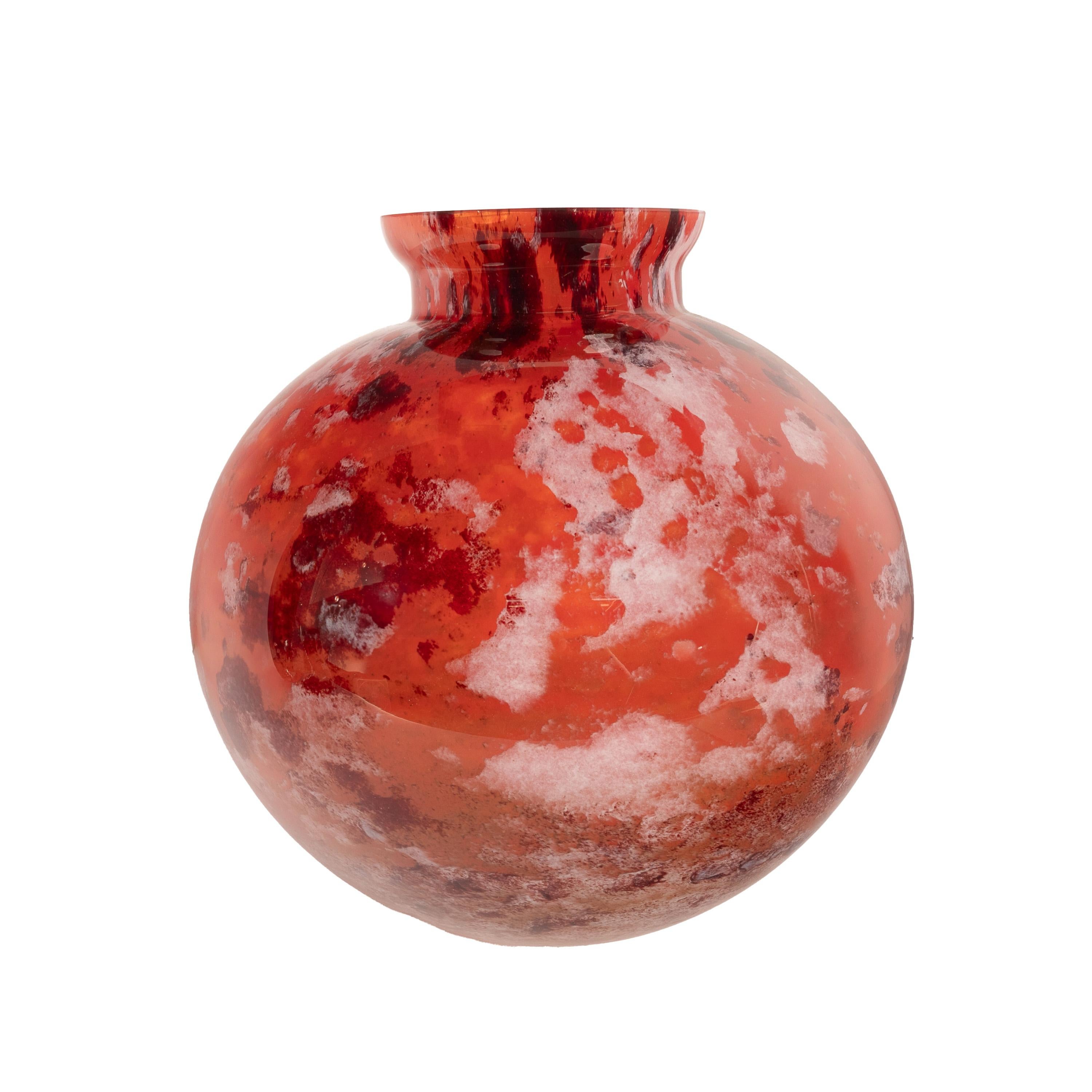 A very charming Art Deco French art glass vase, by Verrerie d'Art Lorraine for Daum, circa 1925.
The globe shaped vase with a short flared neck, the vase having mottled decoration with a red ground with black and cream colored areas, the vase with