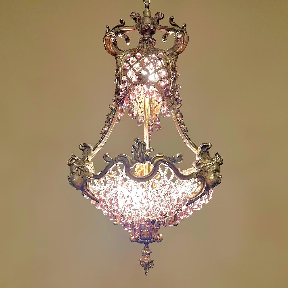 Antique French Art Nouveau bronze & crystal chandelier is a stunning work of art that was designed to create a centerpiece for a special room! Hand-cast from solid bronze, it features a graceful pear-shaped design accentuated with various acanthus
