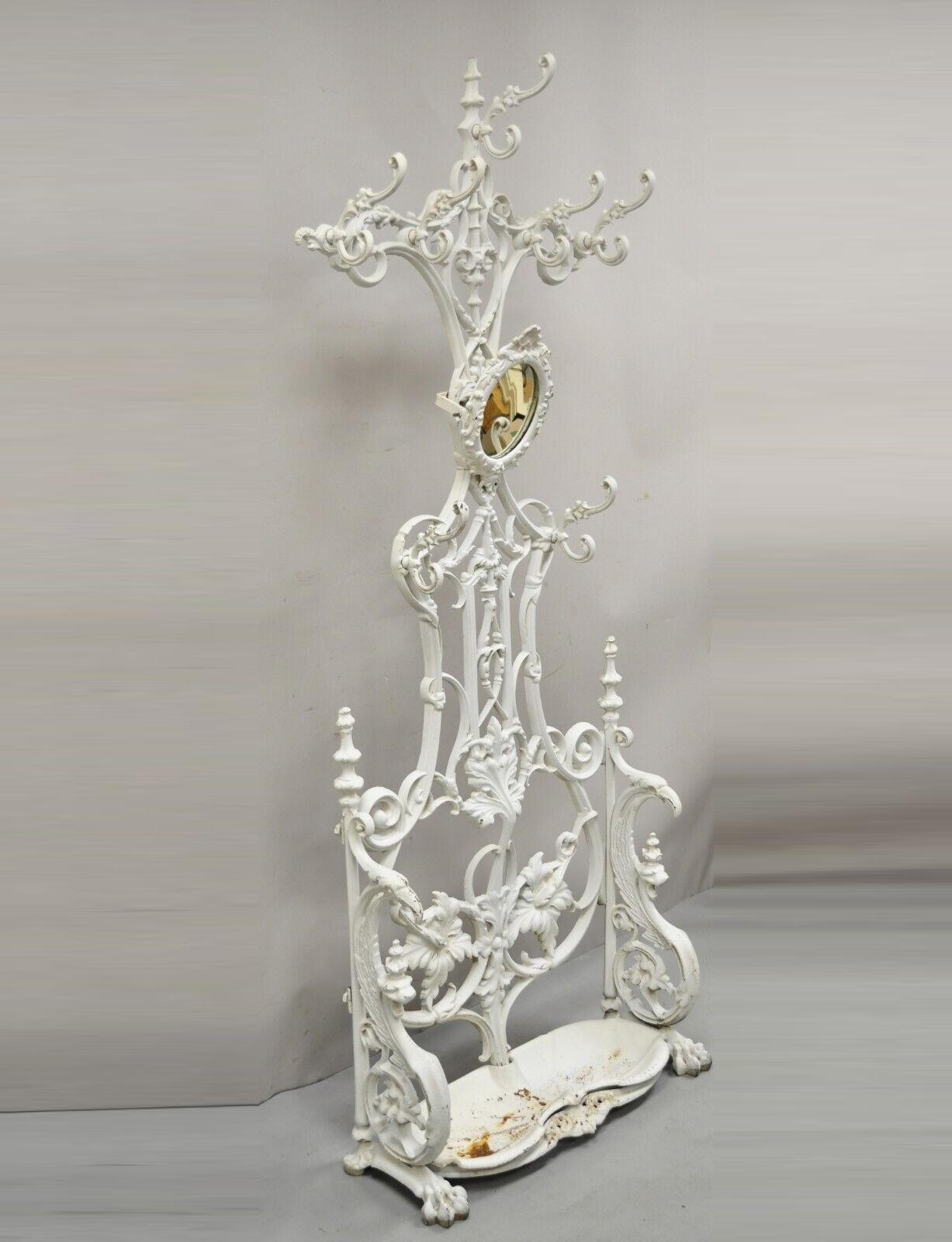 Antique French Art Nouveau Cast Iron Hall Tree Stand attributed to Alfred Corneau. Item features heavy cast iron frame, bird and griffin design to sides, removable cast iron shell form drip pan, ornate leaf and vine scroll work, paw feet, very nice