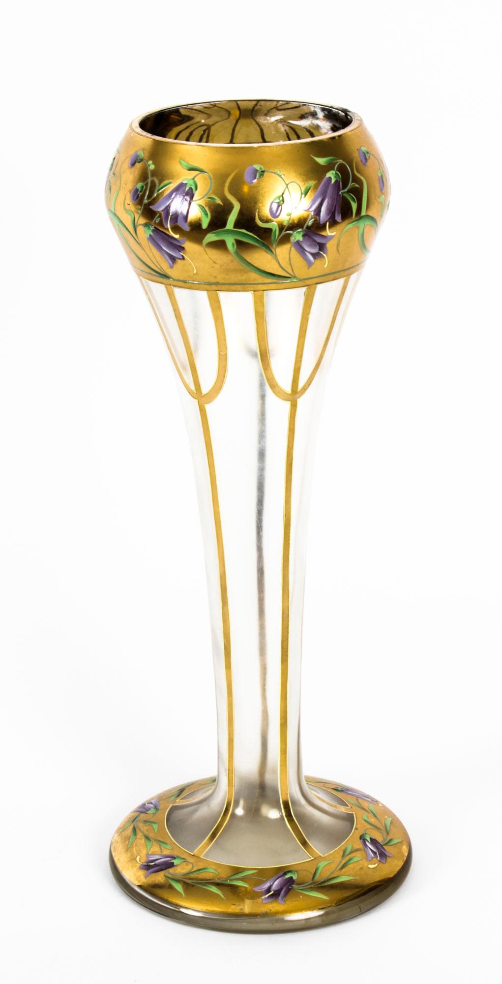 A large antique French Art Nouveau enameled glass vase, circa 1890 in date.

The tall frosted glass vase features a squat ballon base with a long slender tapering stem that opens into a large sphere decorated with gilded high-lights and enamelled