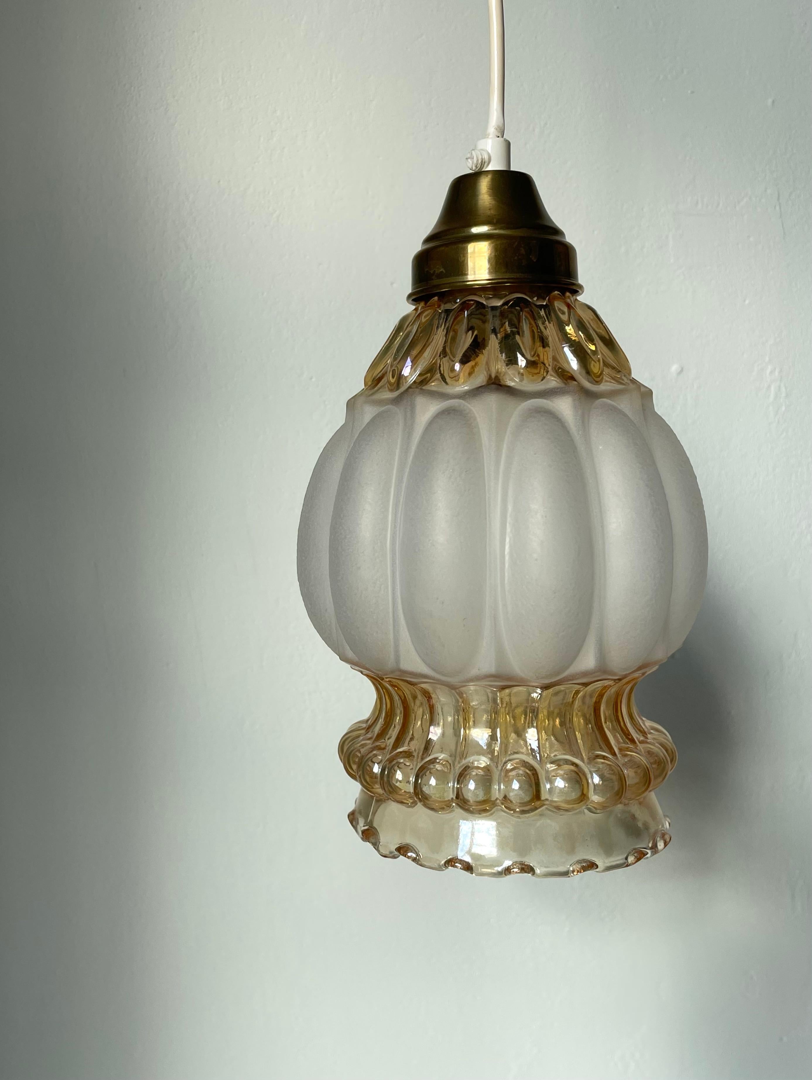Antique French Art Nouveau ceiling light with bulging soft shaped white frosted glass, textured amber coloured art glass and brass top. Lots of textures making the light manifest itself from the different angles through the soft shaped glass parts.