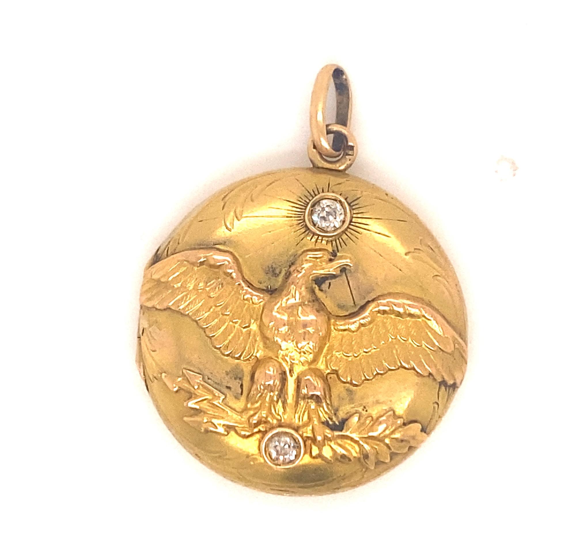 This is a beautiful and rare hallmarked French art nouveau locket c.1920.  The locket depicts the Imperial Eagle in great detail.  The locket has two old mine cut diamonds .20 carats. The locket opens and closes securely. Inside has glass portions