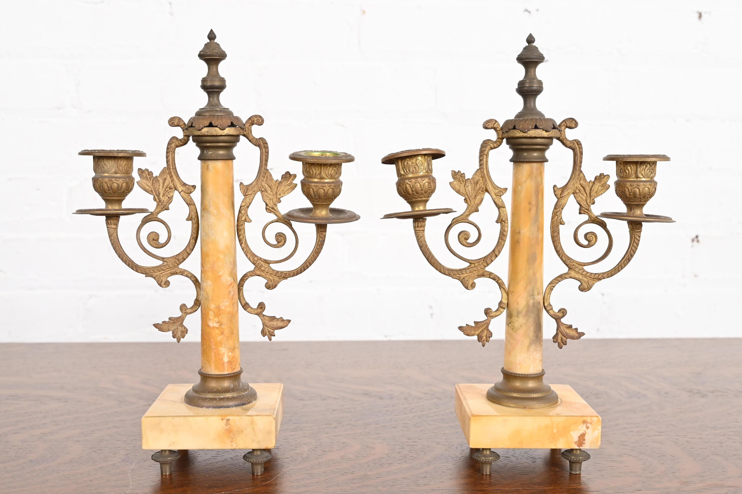 A gorgeous pair of antique French Art Nouveau brass and marble two-light candelabras

France, Circa 1900

Each measures: 7.5