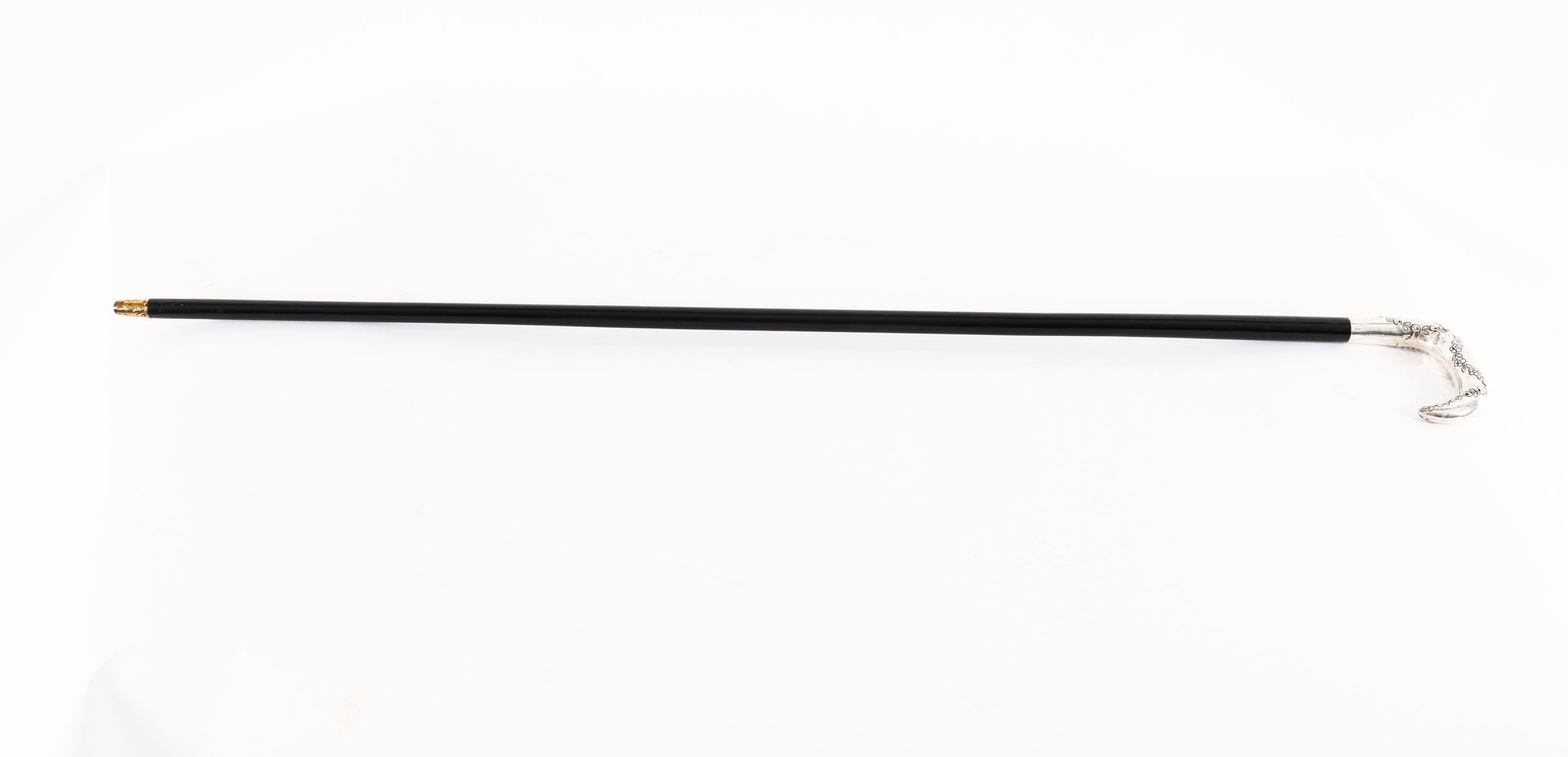 A superb antique French Art Nouveau silver handled walking stick, Circa 1880 in date.

It features astunning  silver crook handle embossed with floral garlands with a decorative inset oval cabochon of nephrite, with an ebonised hardwood tapering