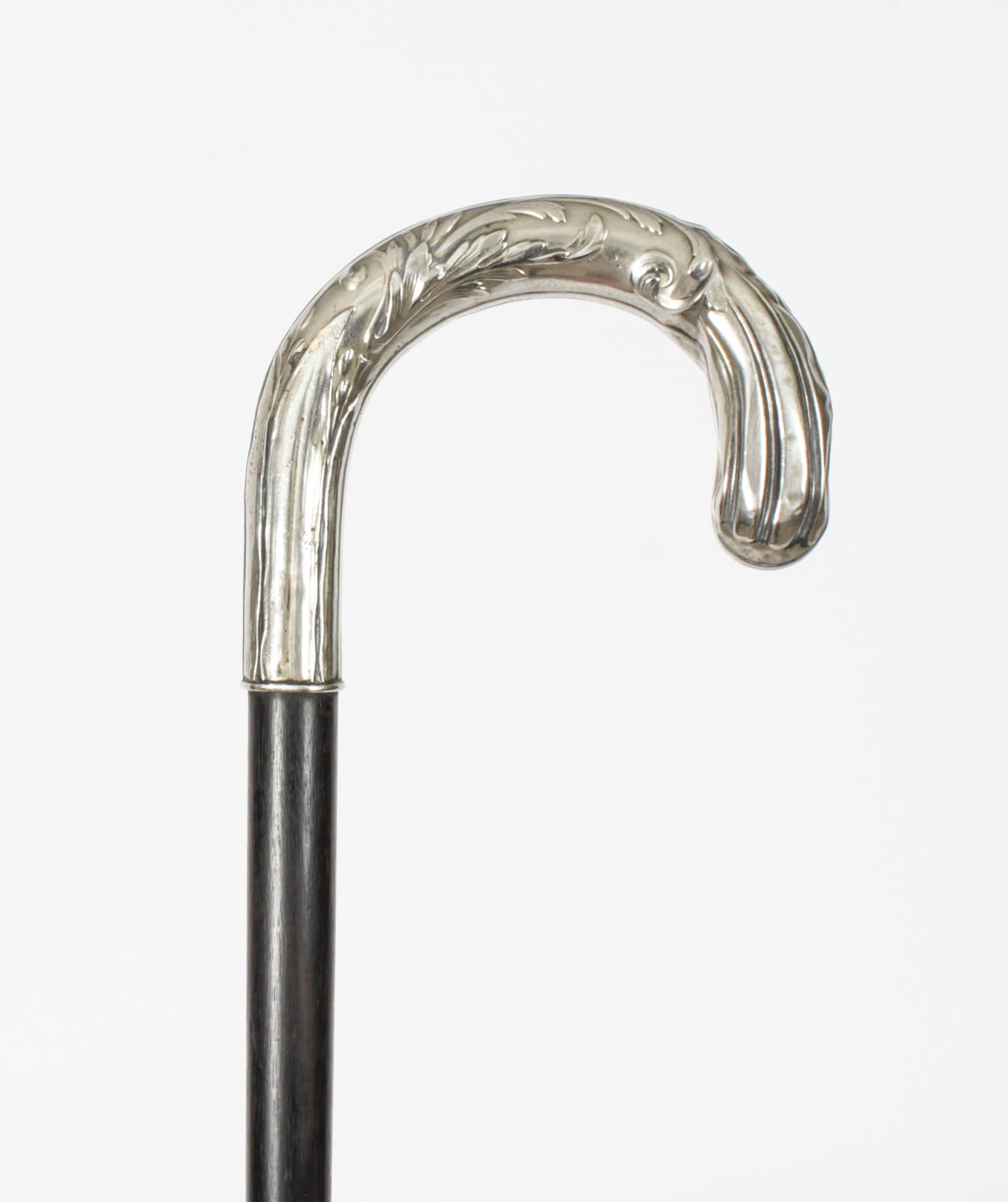 A superb small antique French Art Nouveau silver handled Ladies walking stick, C1880 in date.

It has a very decorative silver curved fluted handle, made with great attention to detail, with a sturdy tapering shaft.

It is a lovely item and as such