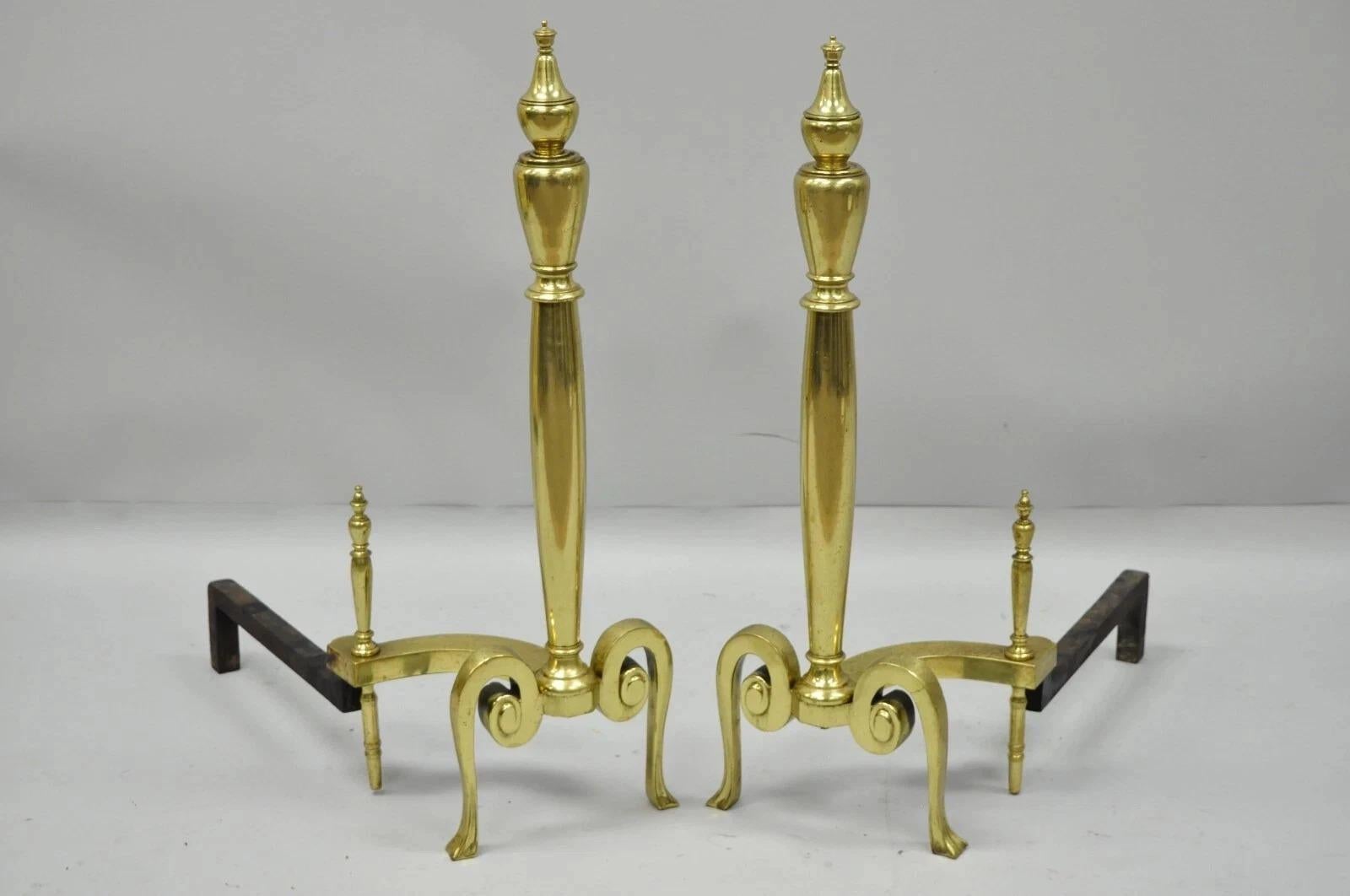 Antique French Art Nouveau Style Brass Urn Finial Fireplace Andirons - a Pair. Item features polished brass forms, shapely scrolling legs, cast iron supports, brass urn finials. Circa Mid 20th Century. Measurements: 26