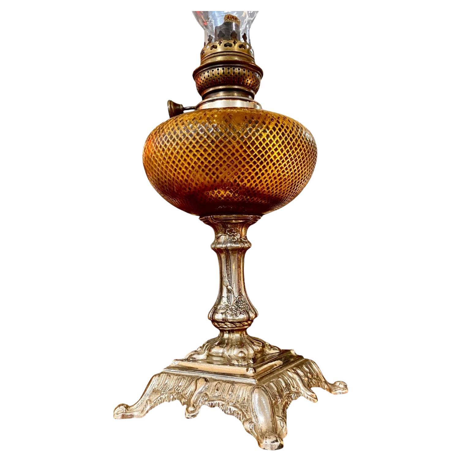 Exceptional and rare, 19th century French Art Nouveau Oil lamp having a stunning topaz cut glass/cross hatched font and a well designed, silvered spelter support. 