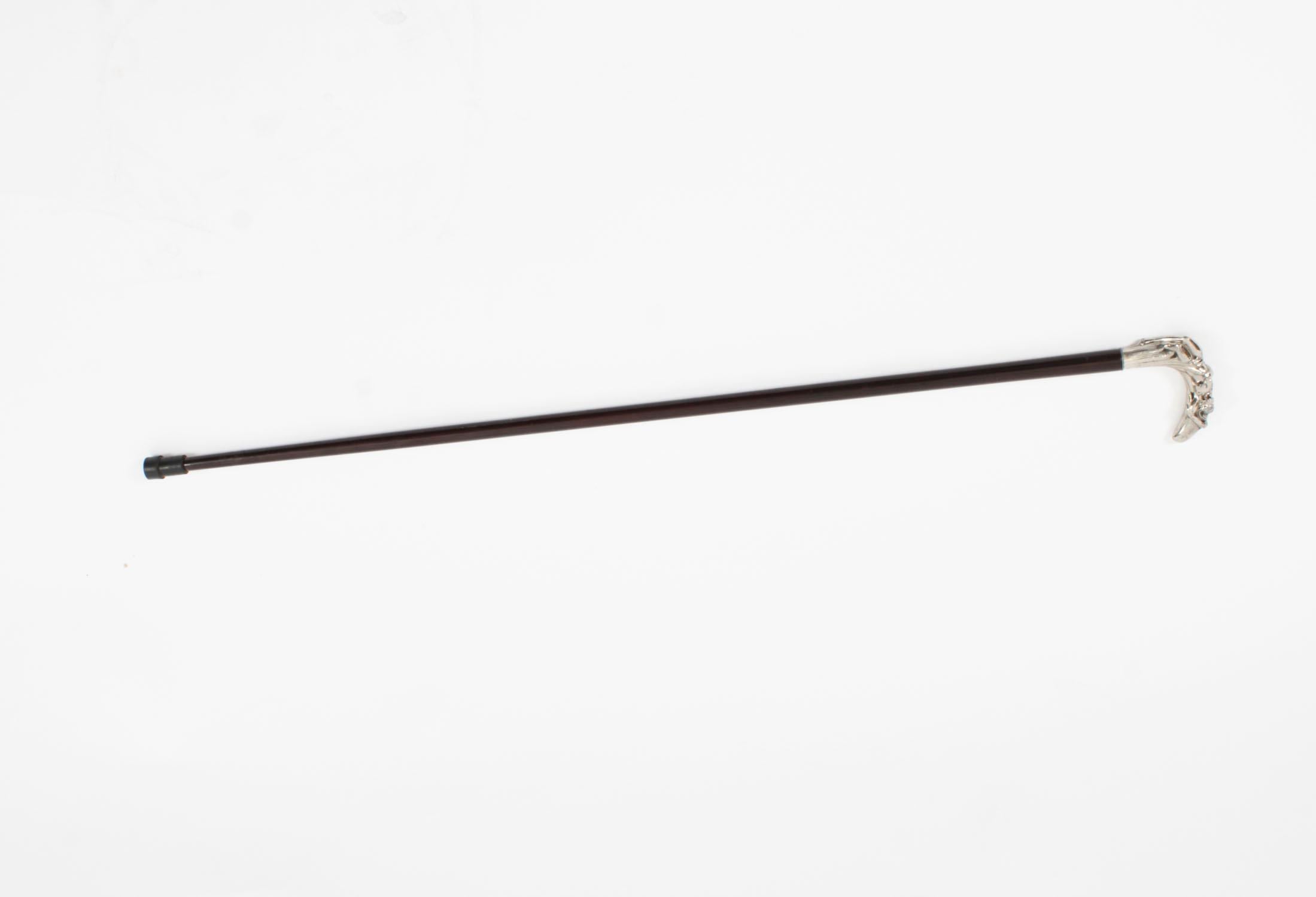 This is a fantastic antique French Art Nouveau silver plated and ebonized walking stick, circa 1890 in date.

It has a beautiful silver plated handle decorated with naked women lying in bull rushes cast with great attention to detail on a sturdy