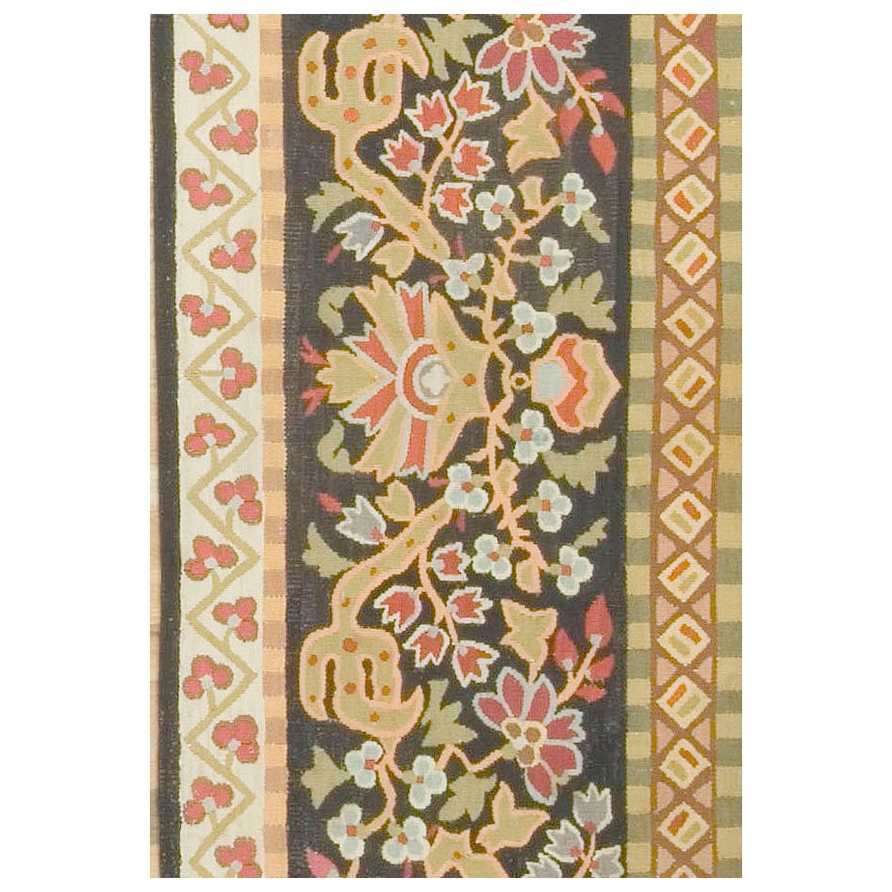 Antique French Aubusson panel, circa 1850, 2'3 x 11'2. This antique Aubusson panel may be used as a runner on the floor or as a wall decoration over a door or between windows or a table runner. The nearly black field displays a very complex pattern