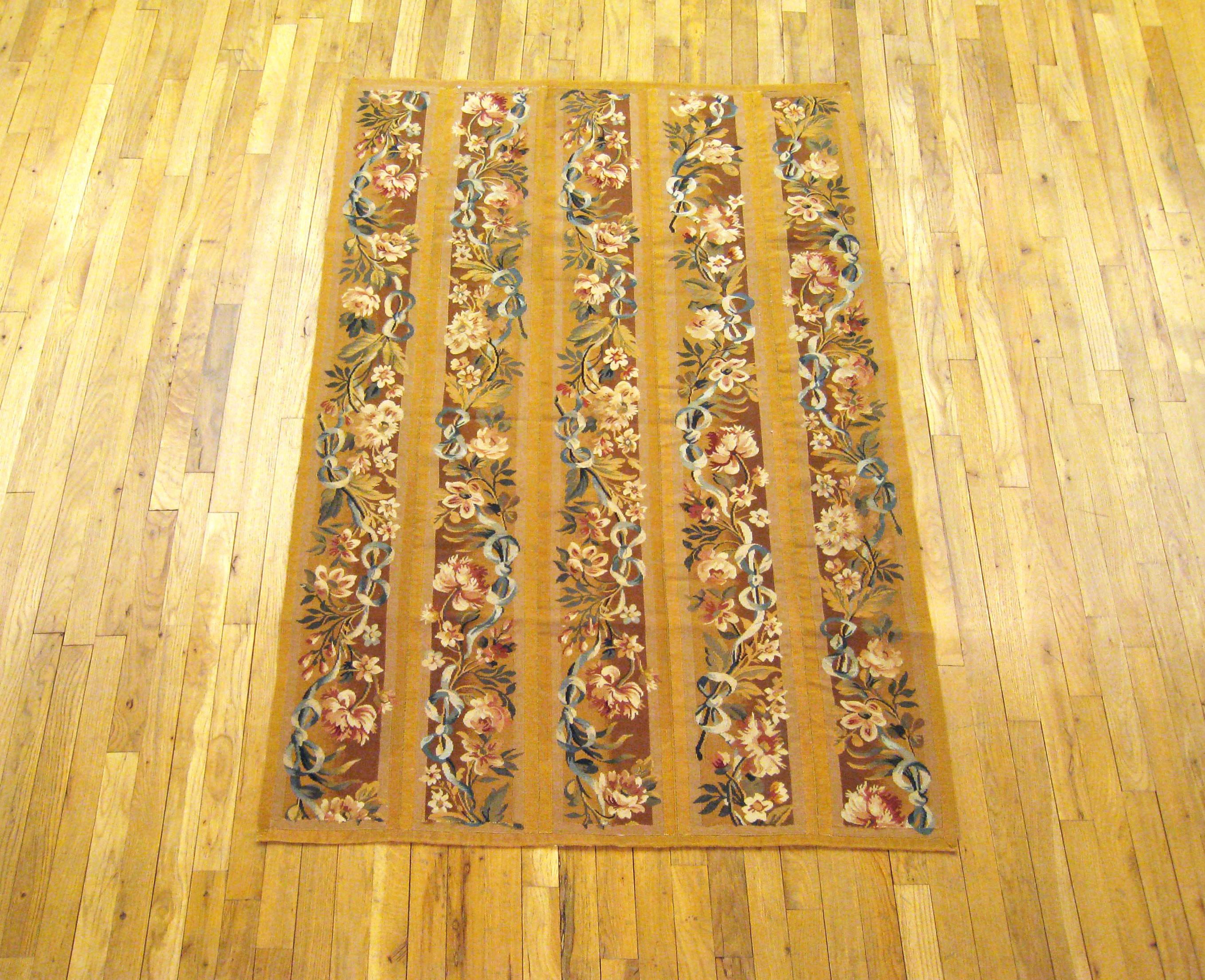 Antique French Aubusson rug, Small size, circa 1890

A one-of-a-kind antique French Aubusson Carpet, hand-knotted with soft wool pile. This lovely hand-knotted wool rug features floral elements allover the brown primary field, with a delicate gold