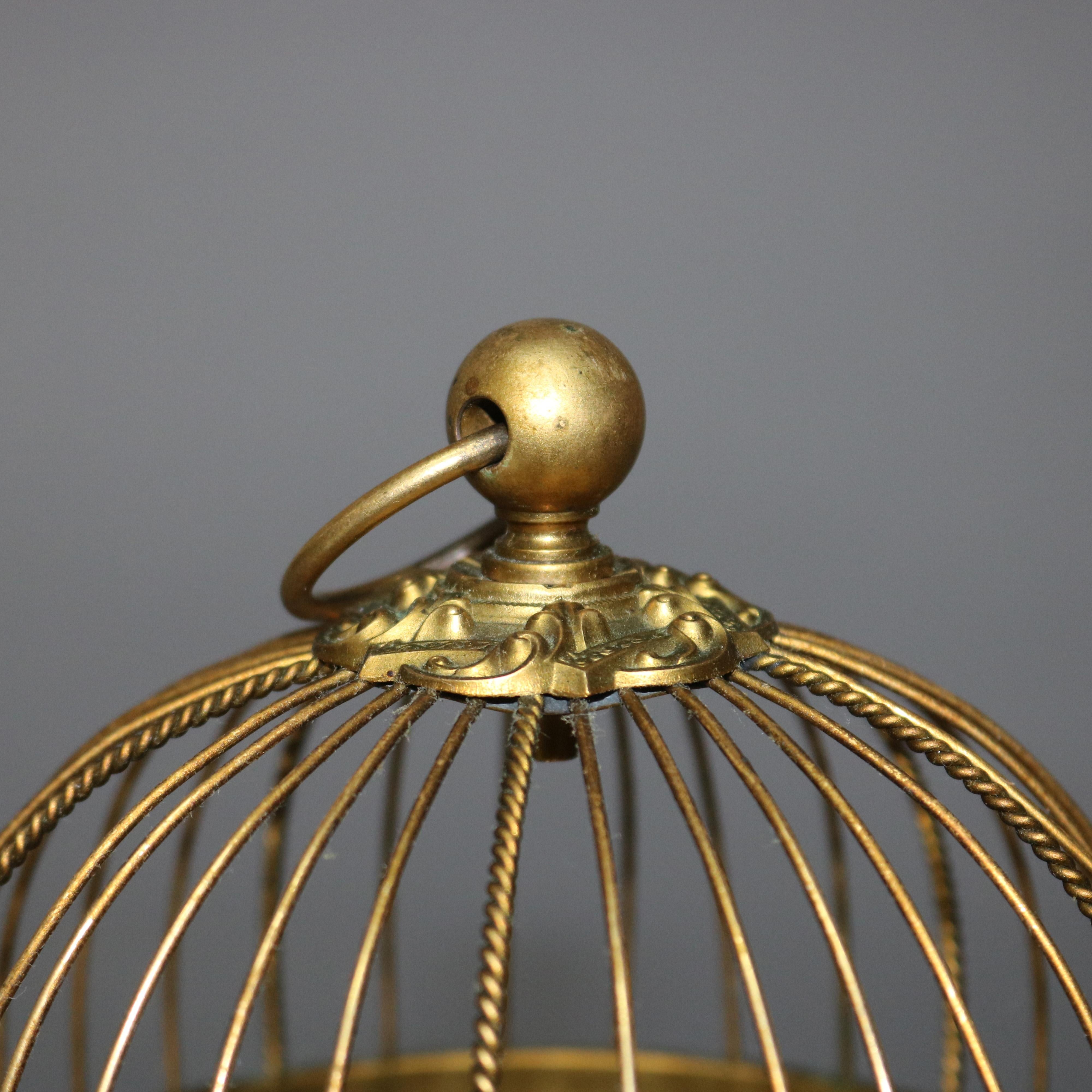 Laiton Automate français ancien:: oiseau chantant dans une cage en laiton:: boîte à musique:: circa 1880