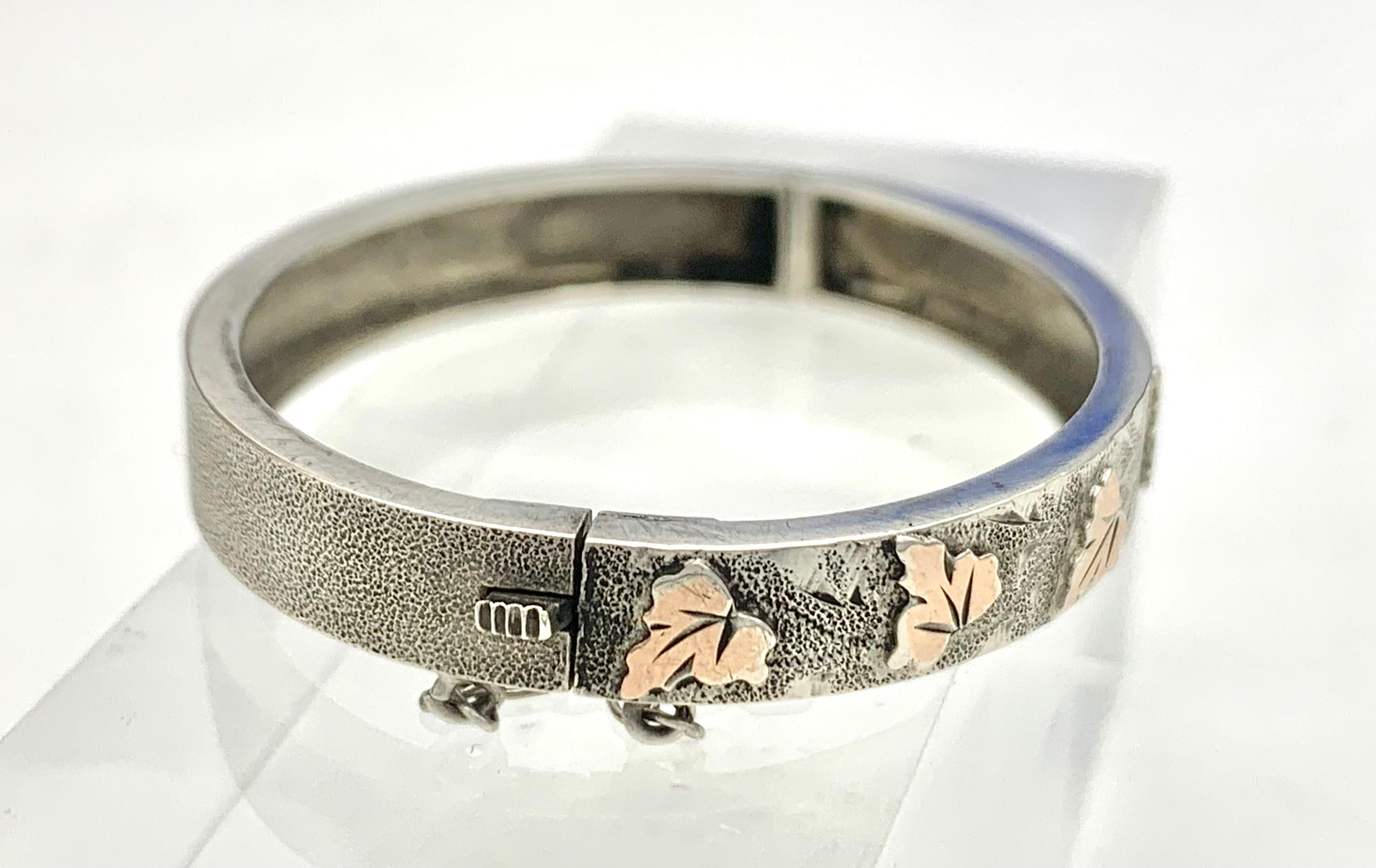 This charming tiny silver bracelet was intended for a newly born child or a doll It was made in France in the 1880' and is fully hallmarked on the tongue of the clasp. The bracelet is finely chiseled and engraved and decorated with raised vine