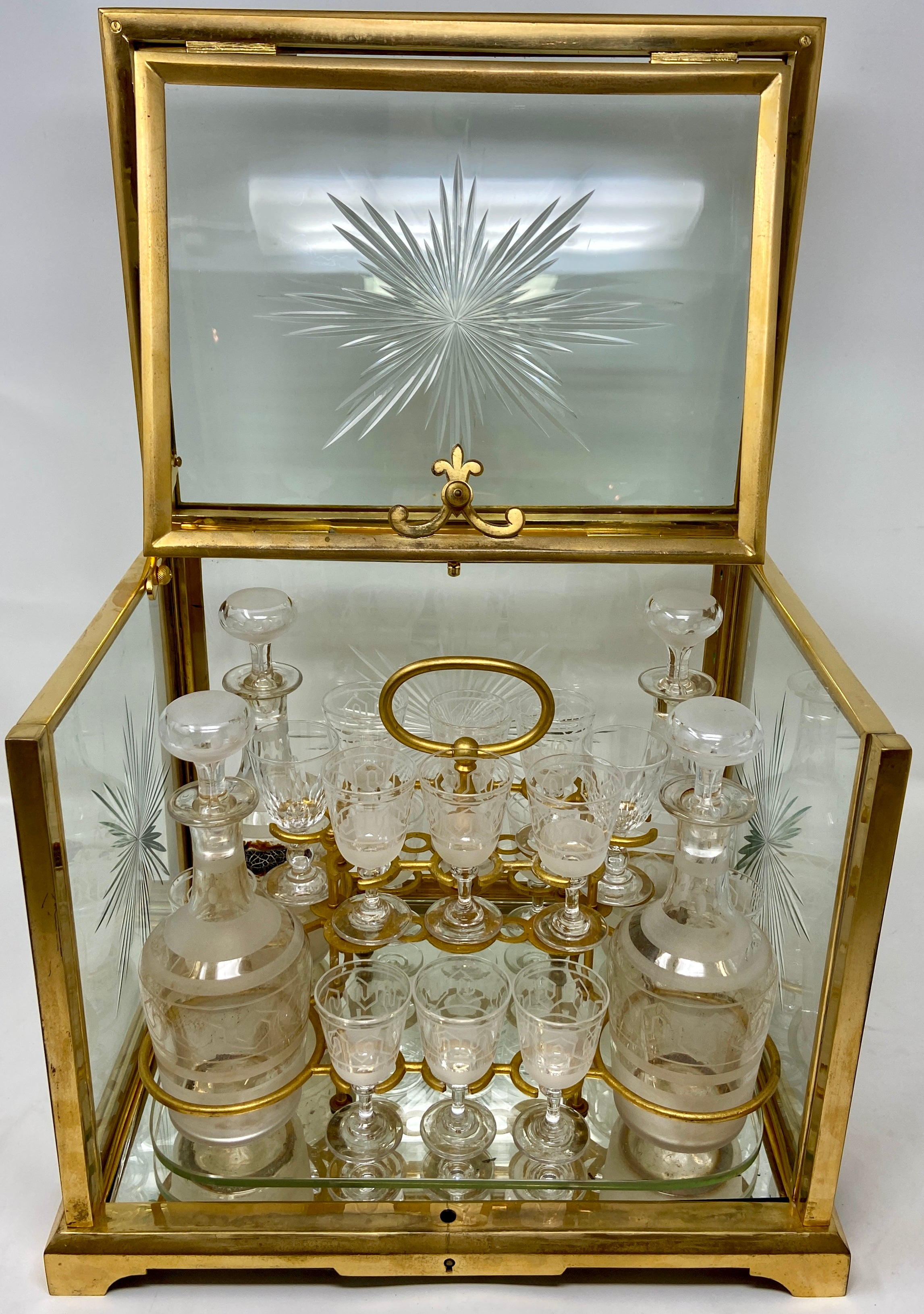 Antique French Baccarat Crystal and Bronze D' Ore Cave À Liqueur, Circa 1890. Fully fitted interior with 4 crystal decanters and 16 cordials
Per photos 12/15 and 13/15, 2 of the crystal cordials were at one point replaced. All other pieces are