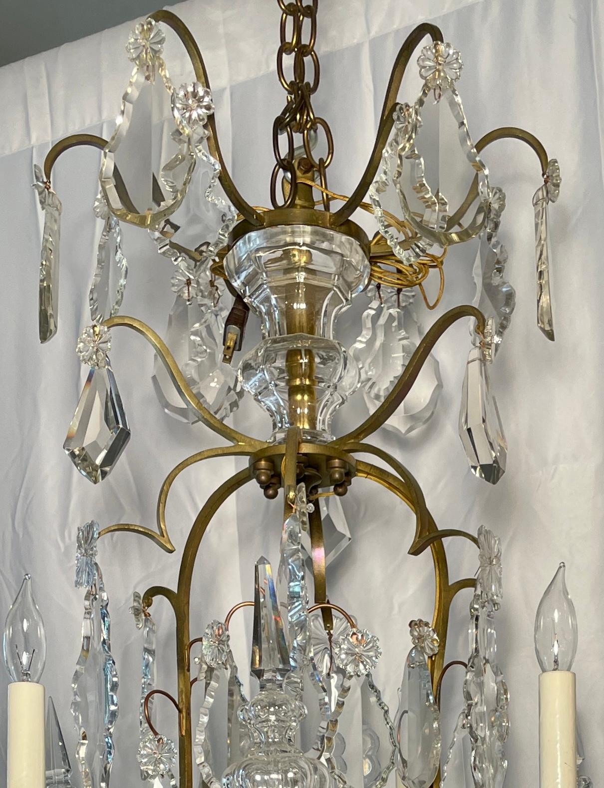 Antique French Baccarat crystal and bronze D' Ore chandelier, circa 1880-1890.
Beautiful open bronze work with large cut crystal prisms.