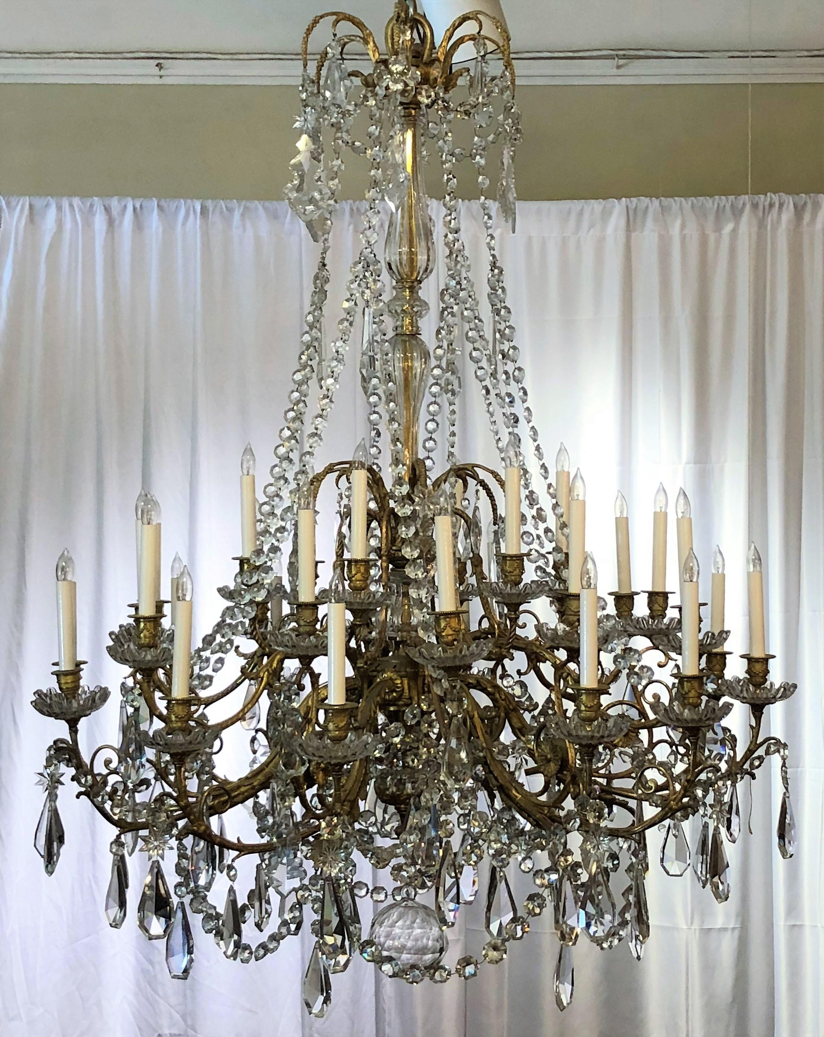 Antique French baccarat crystal and bronze dore 30-light chandelier.